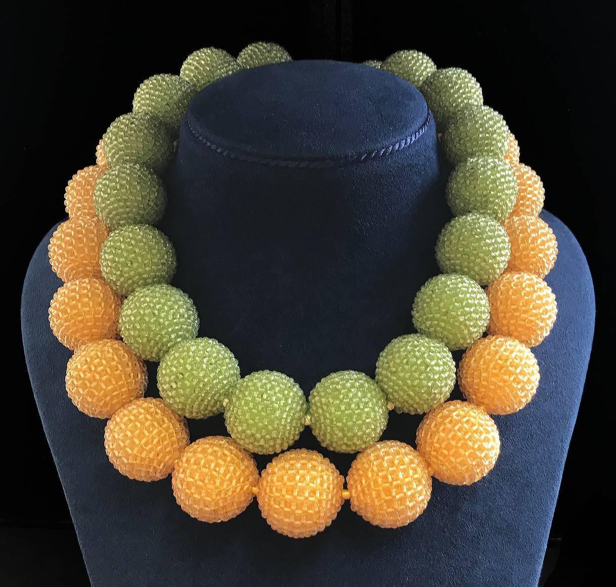 Valentin Magro Large Peridot Gold Woven Ball Necklace is filled with warm verdant hues. The jewel of choice, peridot, is famed for its yellow green shades. These peridots are carved into numerous little beads before they’re woven into 24-25mm balls