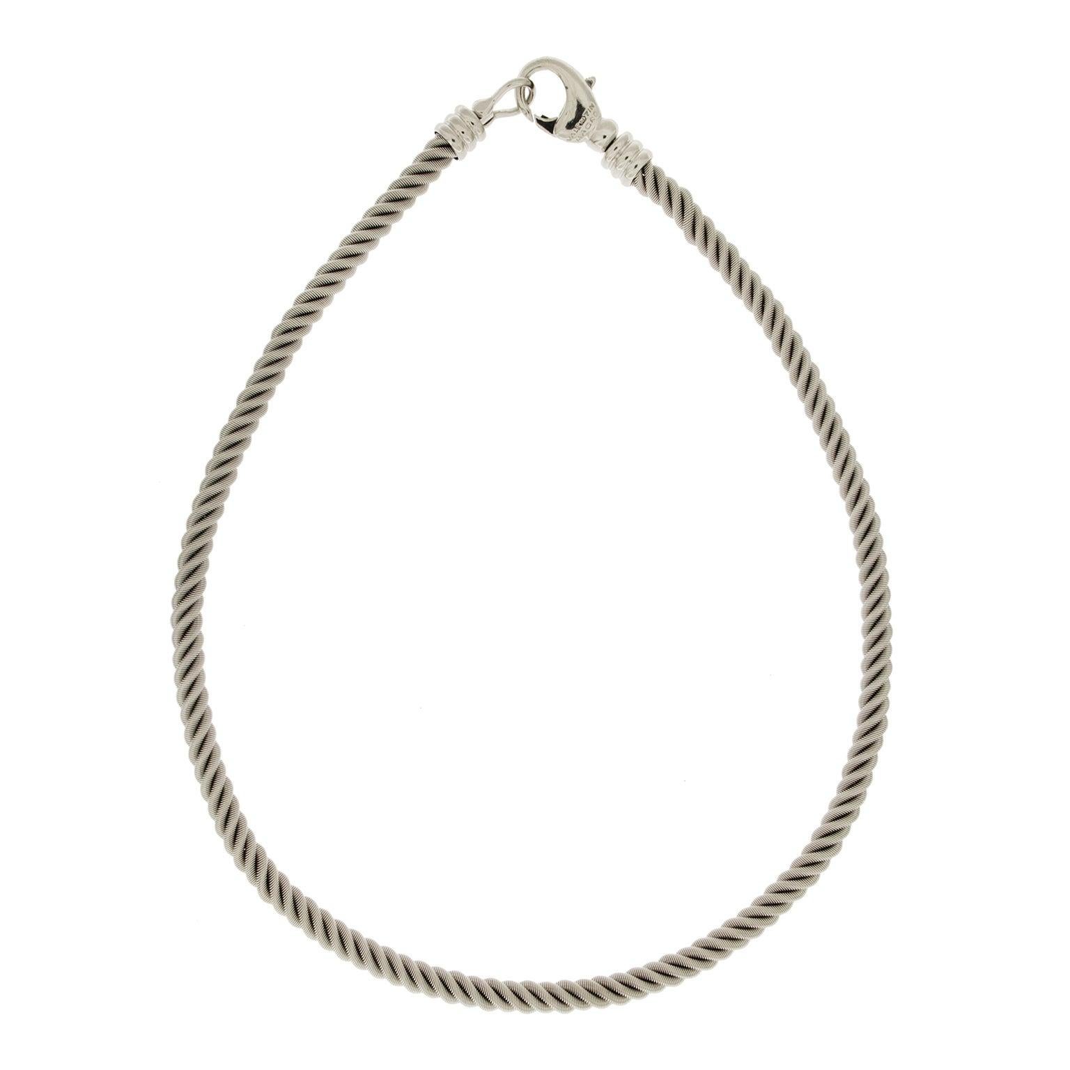 An understated elegance is emitted by this necklace. Slender strands of 18k white gold intertwine to form a design inspired by rope. The texture adds depth to the design. A lobster clasp of coordinating metal closes the necklace, which measures