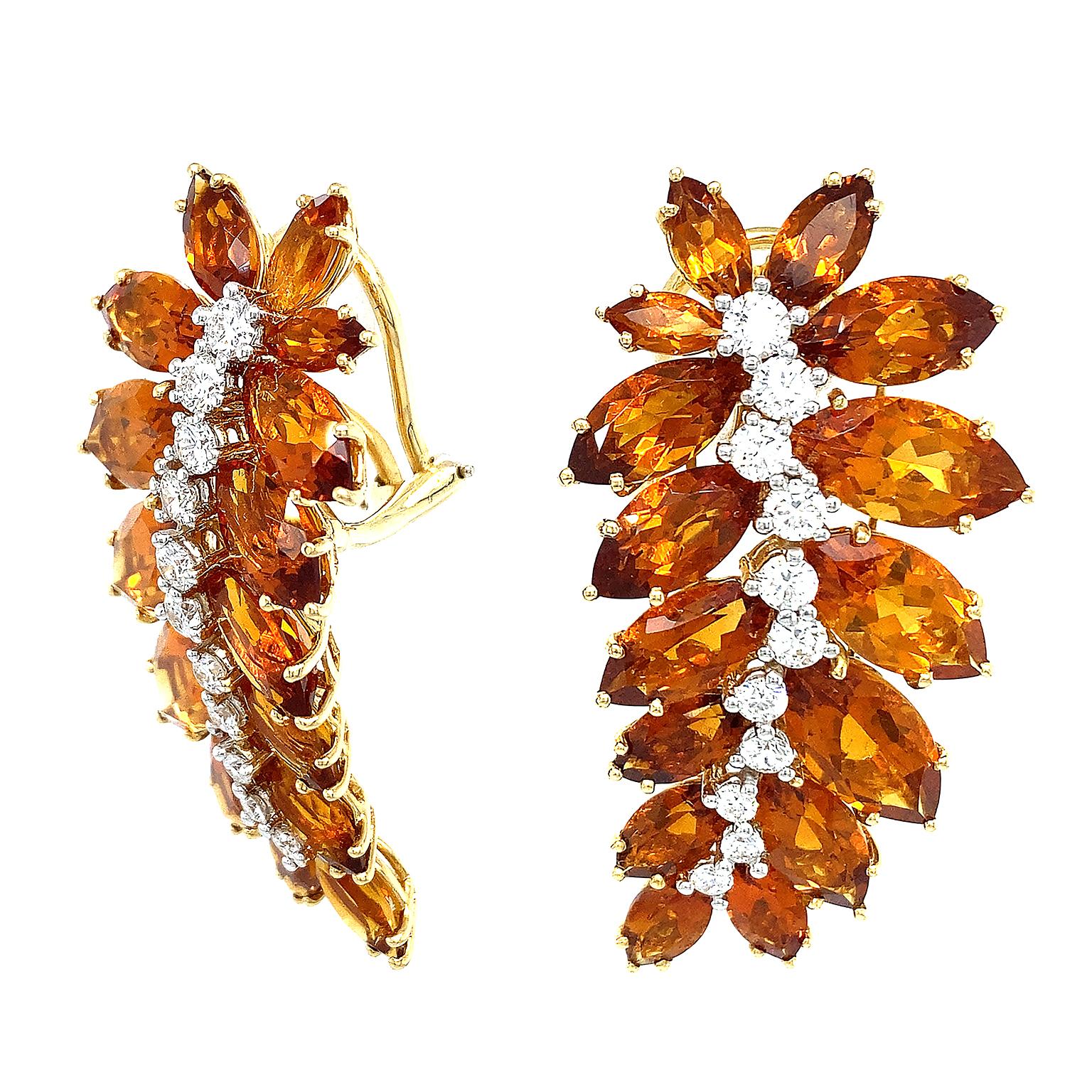 Madeira citrines evoke a fiery autumn light for these earrings. The gemstone is cut into marquise shapes and 18k yellow gold mounts each securely. Brilliant cut diamonds decorate the stem. The total weight of the stones are 1.65 carats of diamonds