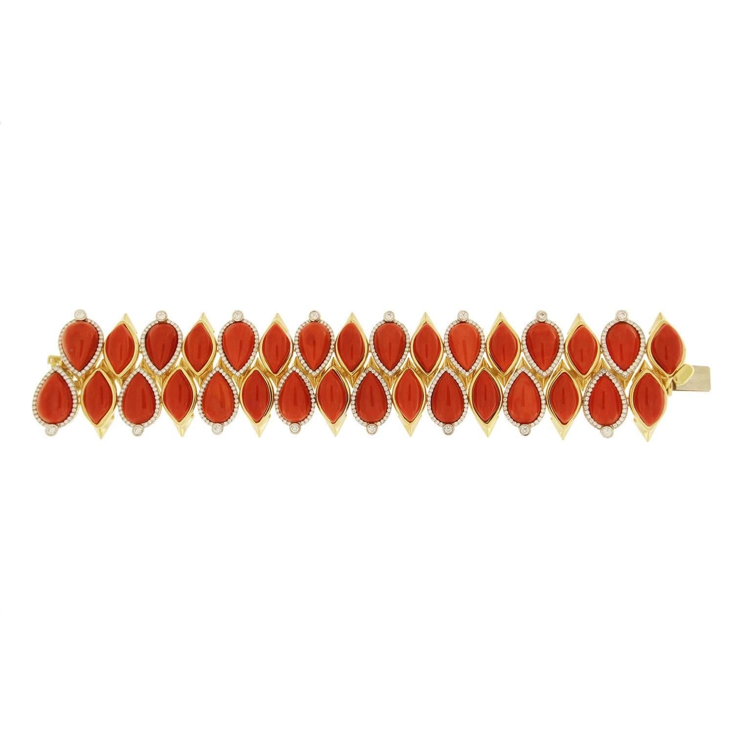 This unique bracelet features special cut Mediterranean Coral and 3.48ct of round diamonds. It is finished in 18kt yellow gold.
