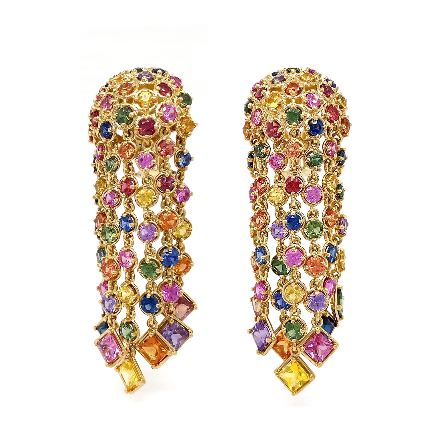 Sapphires of many colors glitter while set in 18k yellow gold for these drop earrings. Round and princess cuts of sapphires, one of the most prized gemstones, totaling 9.78 carats, are displayed. The design starts with an 18k yellow gold bezel set