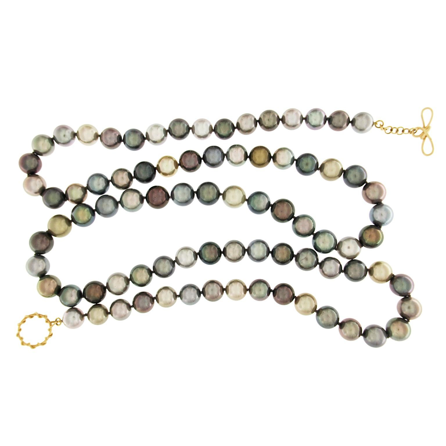 Valentin Magro Multi-Color Tahitian Pearl Necklace showcases a range of color. This necklace showcases Tahitian pearls and their range of color. Deep greys, metallic blues and more fill the strand. As the pearls come closer to the center, they grow