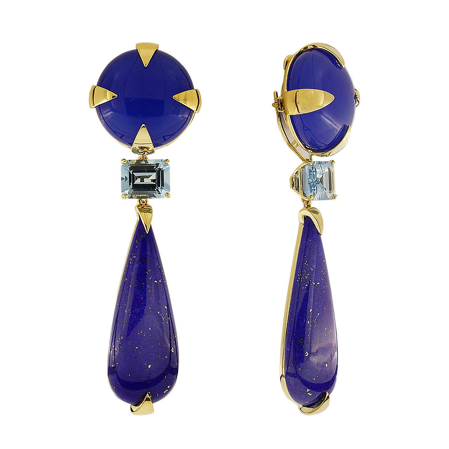 Blue upon blue make these drop earrings, special. Their bases are blue agates carved into rounds. Triangular 18k yellow gold prongs serve as mountings and accent. Underneath are elongated pear-shaped lapis lazuli, speckled in gold. Between the