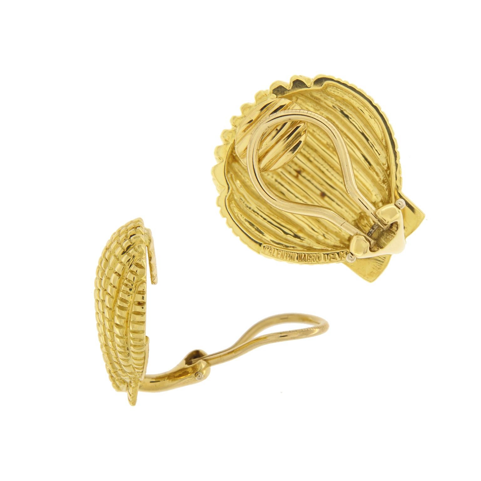Gold depicts a marine theme for these earrings. A scallop shell is formed with a base of polished 18k yellow gold with soft ridges to create vertical rows for definition. Indentations across the rows, as well as the triangular shapes at the tapered