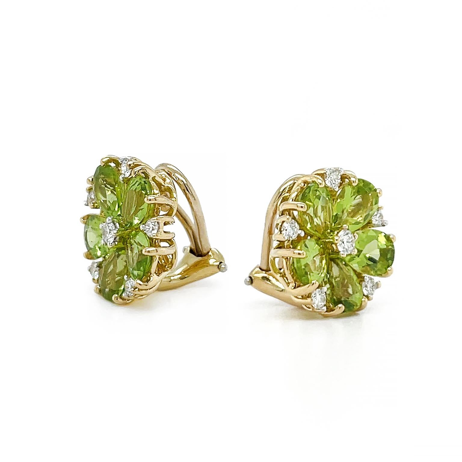 Glistering jewels imitate nature in these earrings. Sparkling pear-shaped peridots are arranged with their broadest edges facing out. Their tapered points draw the eye to a single brilliant-cut diamond in the center. In between each peridot, a