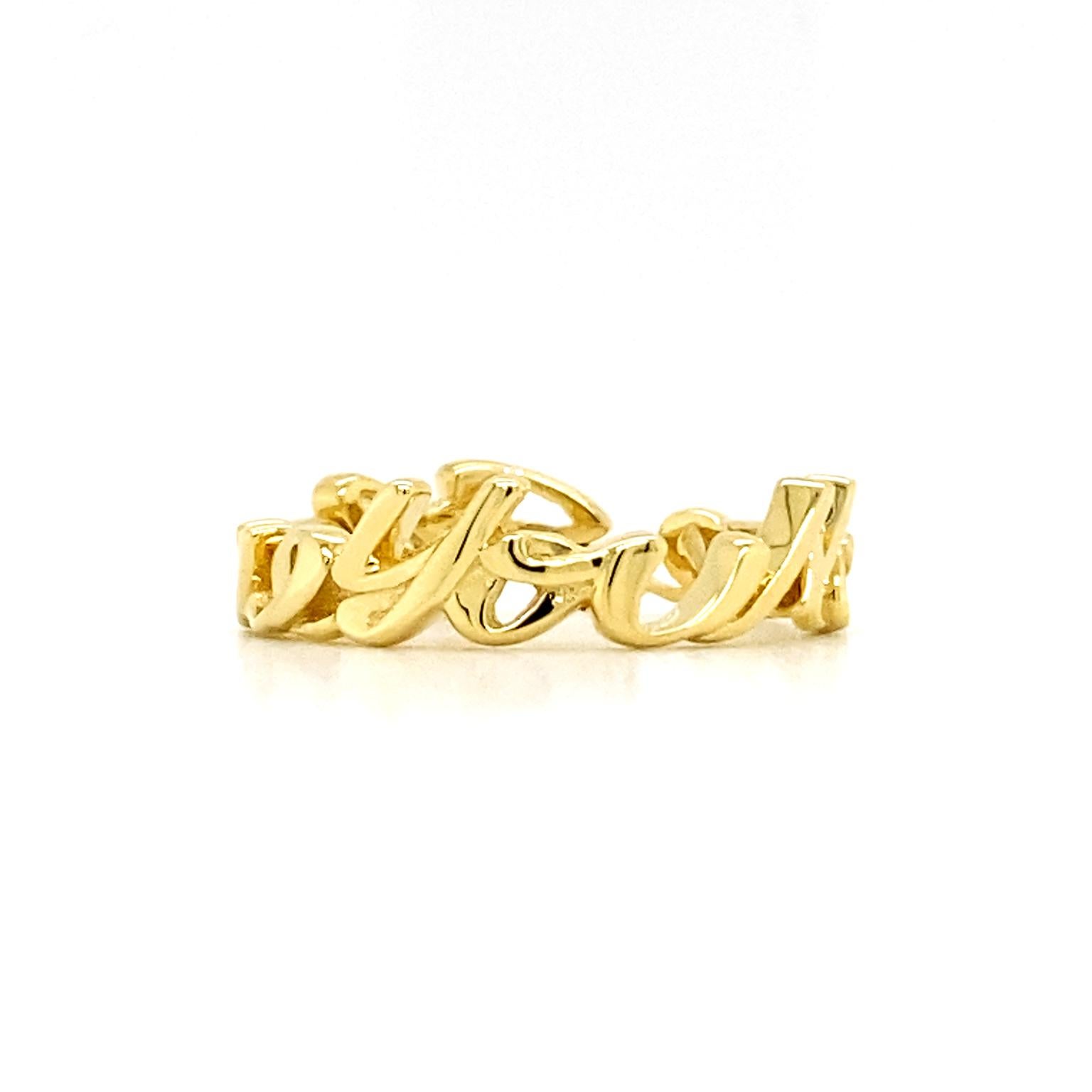 Valentin Magro I Love You More Ring - Script - 5mm is made of romance. The material of choice is 18k yellow gold with a glossy finish. It’s shaped into 5mm tall letters, creating the phrase 'I love you more.' The message’s cursive nature allows the