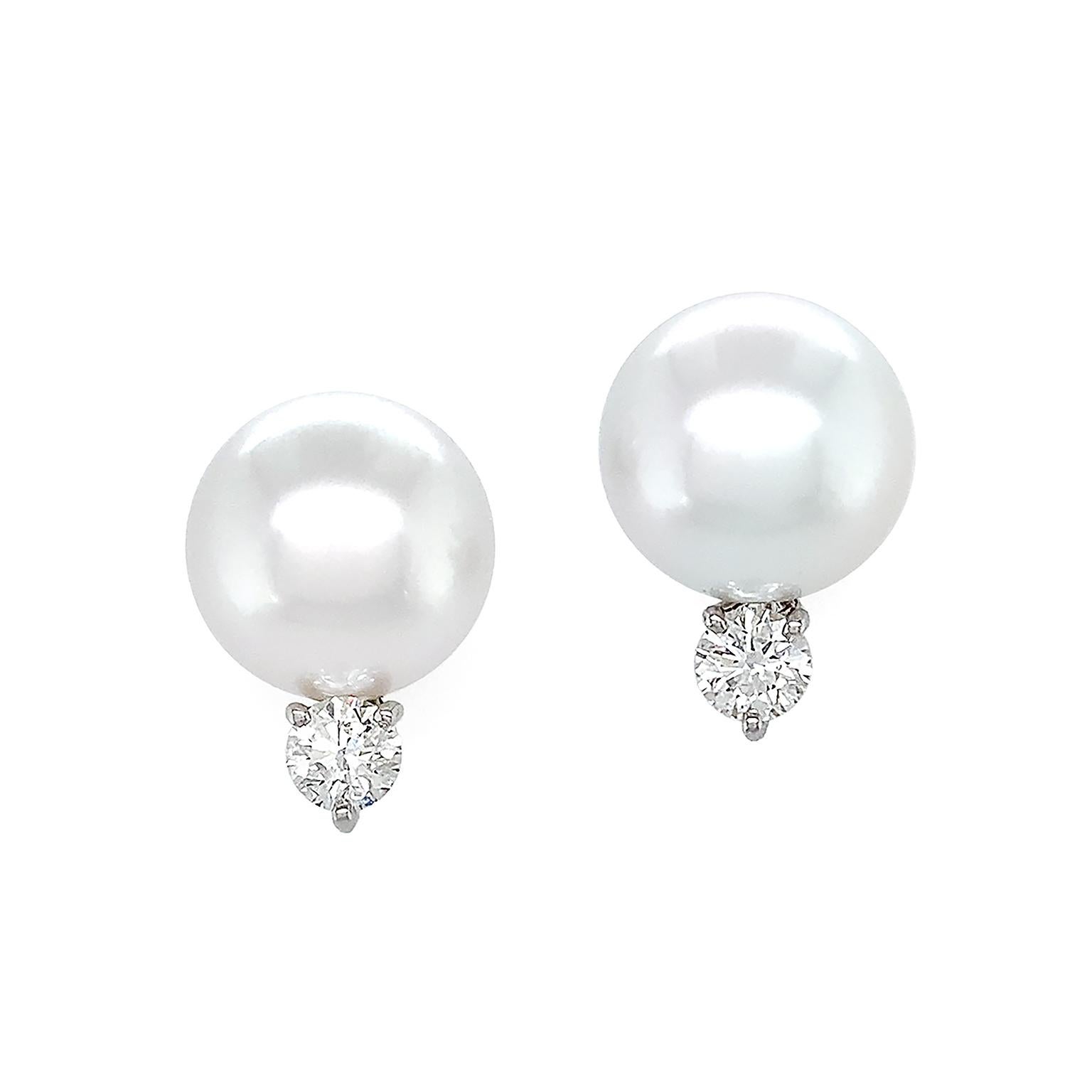 South Sea pearls, treasured for the sheen across their nacre bodies, are the basis of these earrings. Above is a single radiant round south sea pearl. Beneath the pearl features a brilliant cut diamond secured by platinum prongs for an opulent