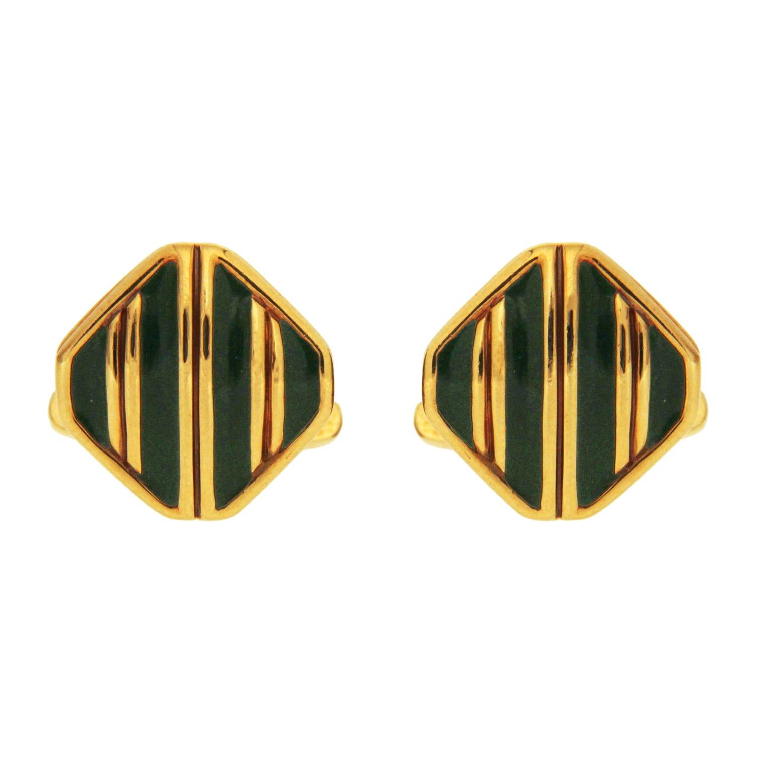 Valentin Magro Striped Green Enamel and Gold Cufflinks are accented with stripes. The body of these pieces are made of 18k yellow gold. On the front, dark green enamel provides background decoration. Diagonal gold stripes cross the front and a thin
