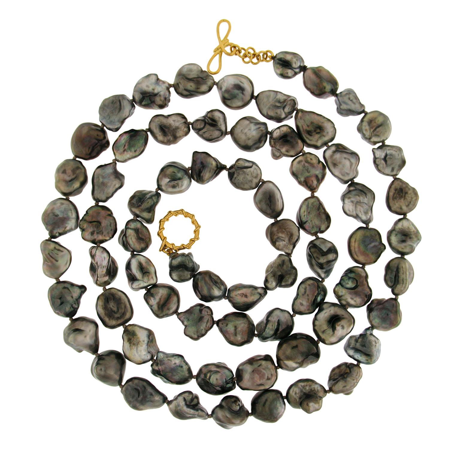 Valentin Magro Tahitian Keshi Pearl Necklace blend two distinctive gems. Tahitian pearls are prized for their dark body colors and regal overtones such as gold and purple. This strand uses keshi pearl versions, adding a variety of shapes and strong