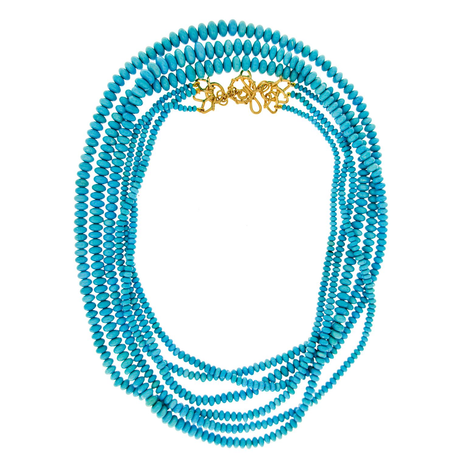 Three-Strand Turquoise Necklace twist with blue. The jewel of choice is sleeping beauty turquoise, selected for their uniform hues without a hint of matrix. They’re carved into roundels before being placed on one of three cords and spiraled into a