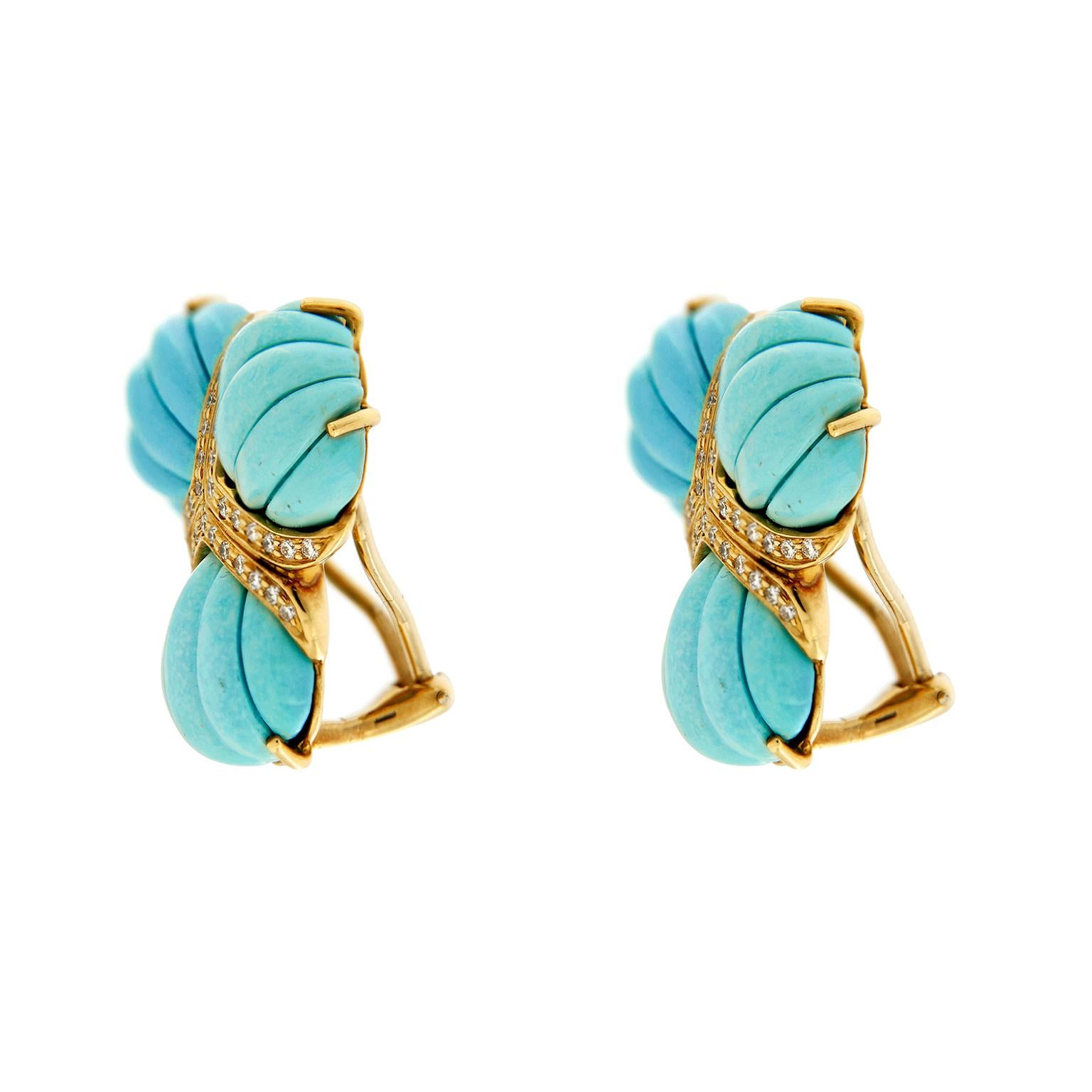 Cool tones adorn these earrings created by Valentin Magro. Fine blue turquoise is special cut into fan shapes. The bases of the jewels are edged in round brilliant cut diamonds. Their colorless shades compliment turquoises’ hues. The 18k yellow gold