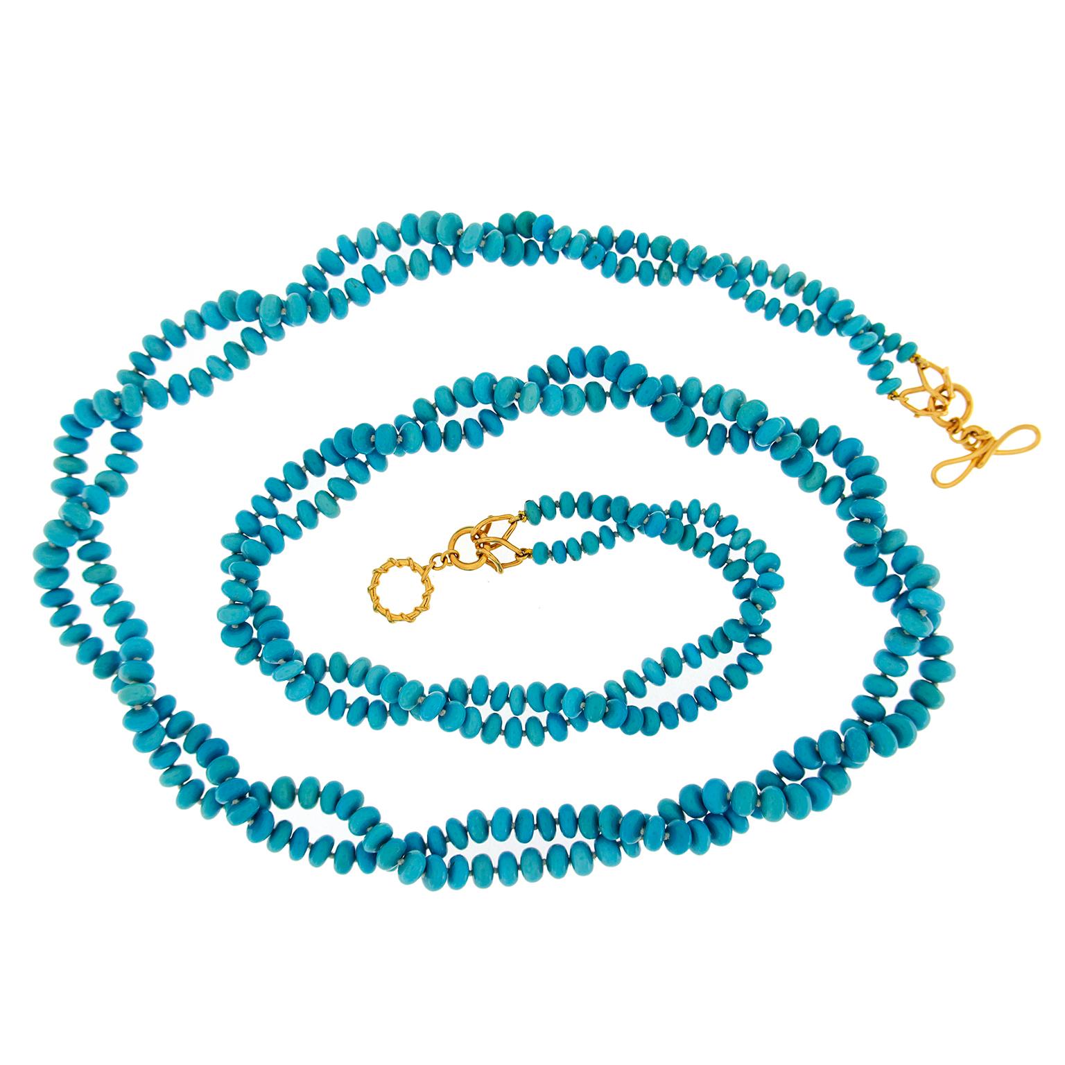 Two-Strand Turquoise Rondelle Necklace features an abundance of beads. It can be worn in many ways, from as-is to looping around the neck, creating a field of blue.  A wire wrapped 18k yellow gold ring-and-toggle clasp featuring interlocking Vs