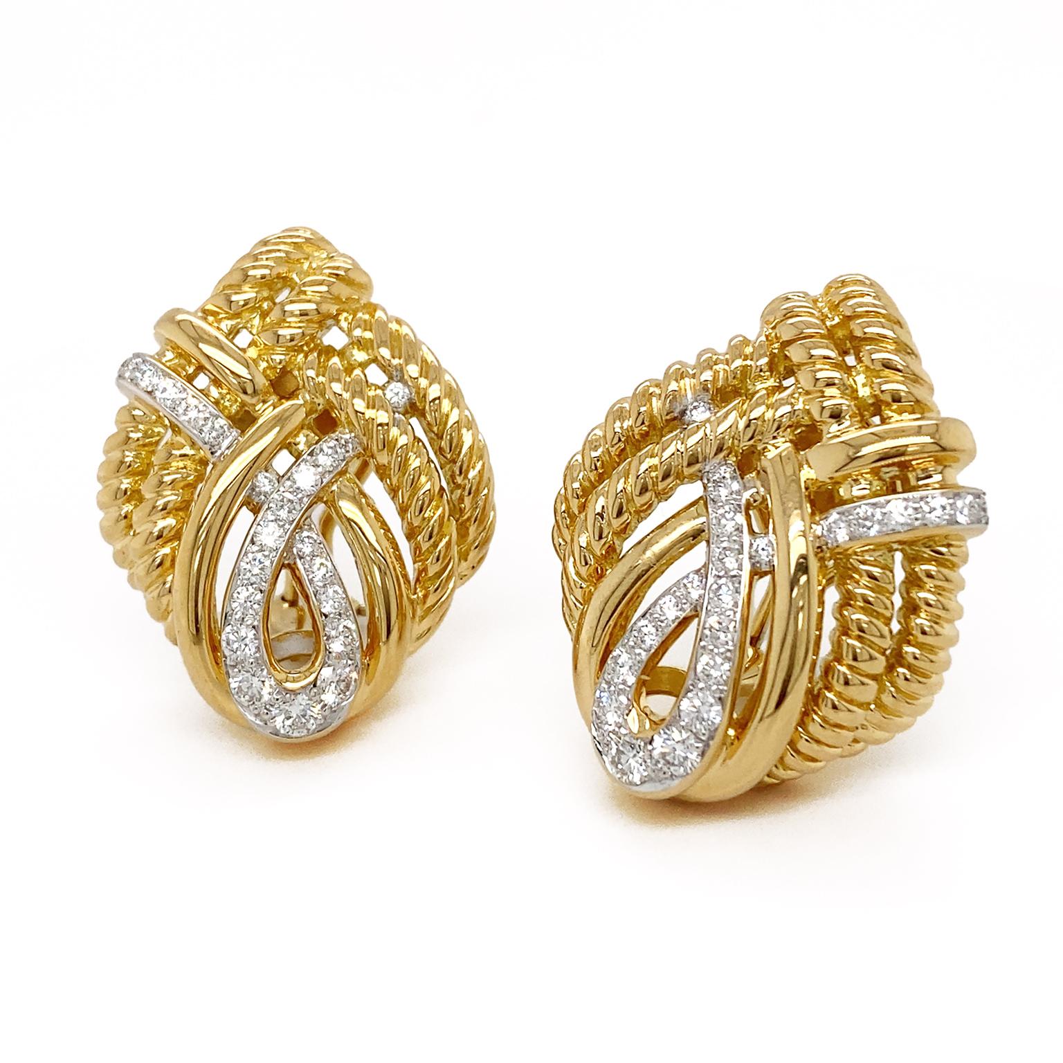 Intricacy and illumination combine for these earrings. 18k yellow gold ropes intertwine to form a subtle teardrop shape. Braided within are a smooth gold band on top and another one interlocked with that made of pavé set brilliant cut diamonds for a
