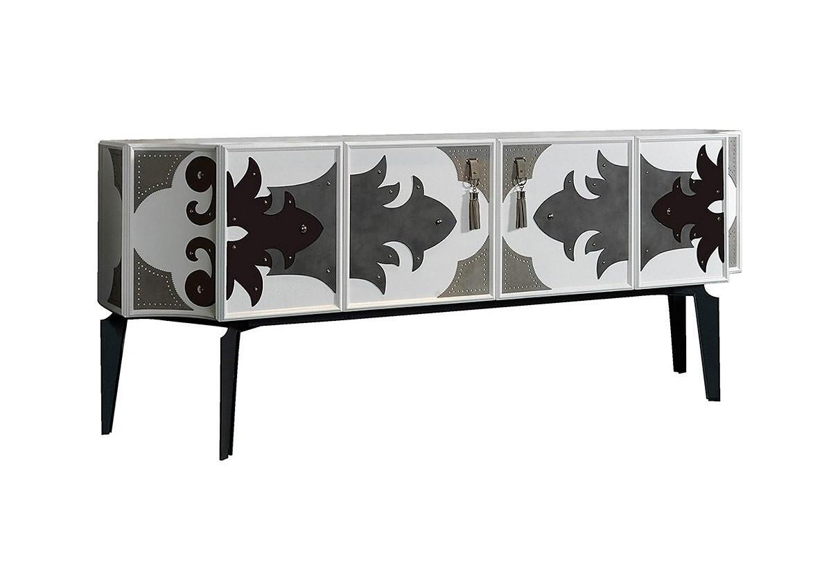 The Valentina sideboard evokes the traditional art of the equestrian world, mainly due to the materials used and traditional crafting techniques producing scalloped edge cuts. With an amazing attention to detail and totally handcrafted, this