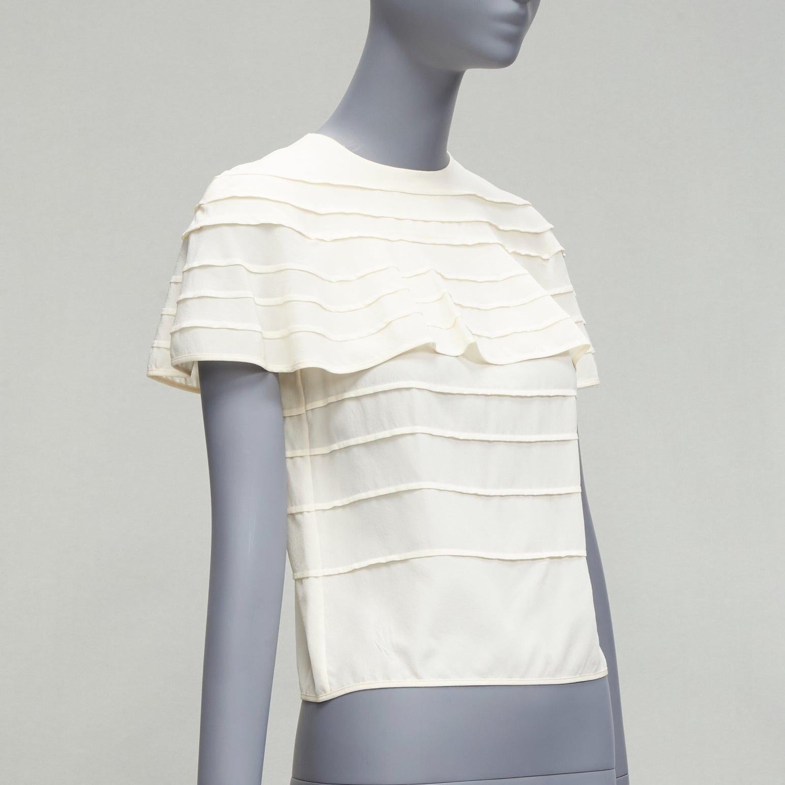VALENTINO 100% silk cream crepe cape sleeves tiered French seam blouse IT38 XS
Reference: LNKO/A02171
Brand: Valentino
Material: Silk
Color: Cream
Pattern: Solid
Closure: Zip
Extra Details: Back zip closure. Cape sleeves detail.
Made in: