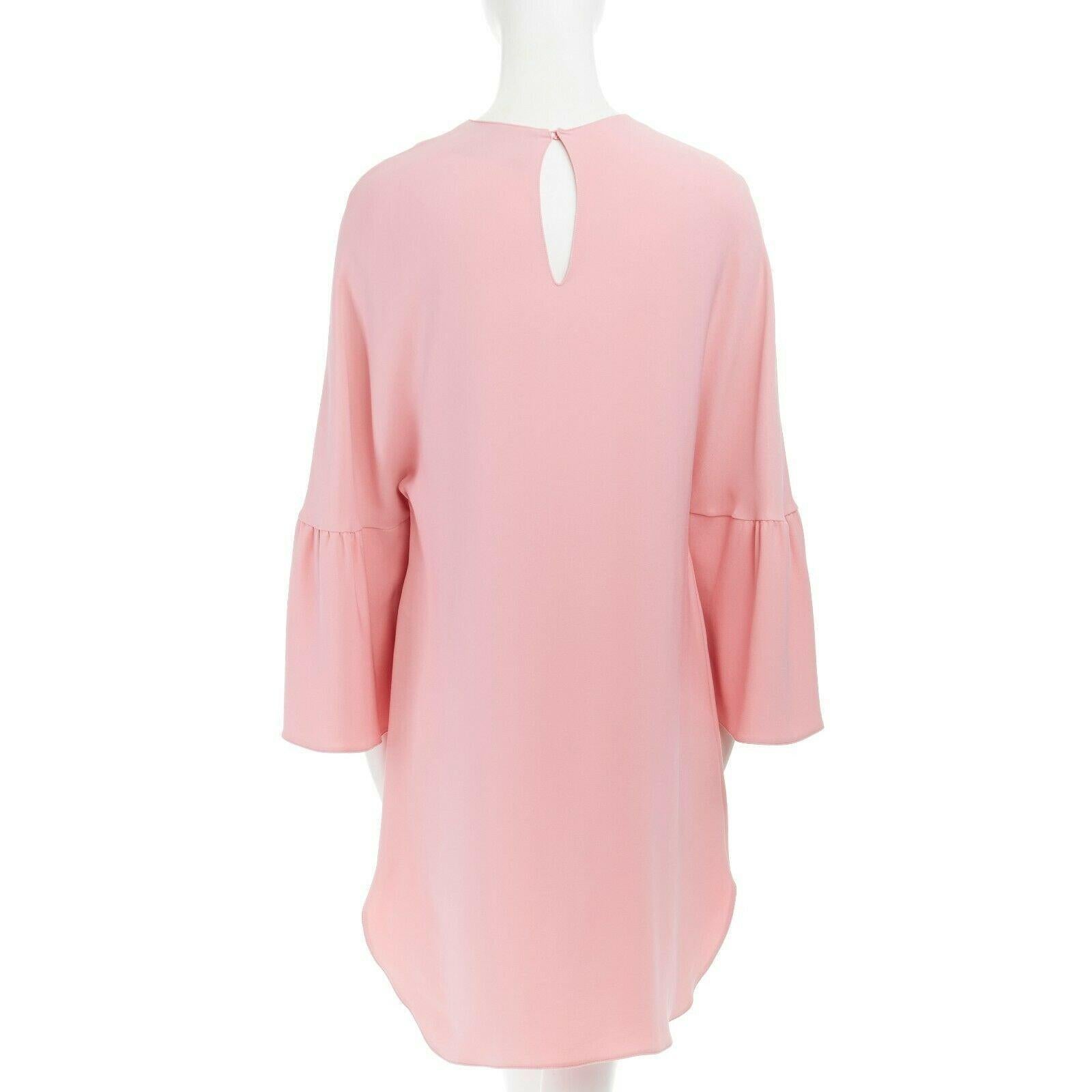 VALENTINO 100% silk pink ruffle bell sleeves loose fit boxy dress IT36 XS 
Reference: LNKO/A01040 
Brand: Valentino 
Material: Silk 
Color: Pink 
Pattern: Solid 
Closure: Button 
Extra Detail: 100% silk. Round neck. Rounded shoulders. Bell sleeves.