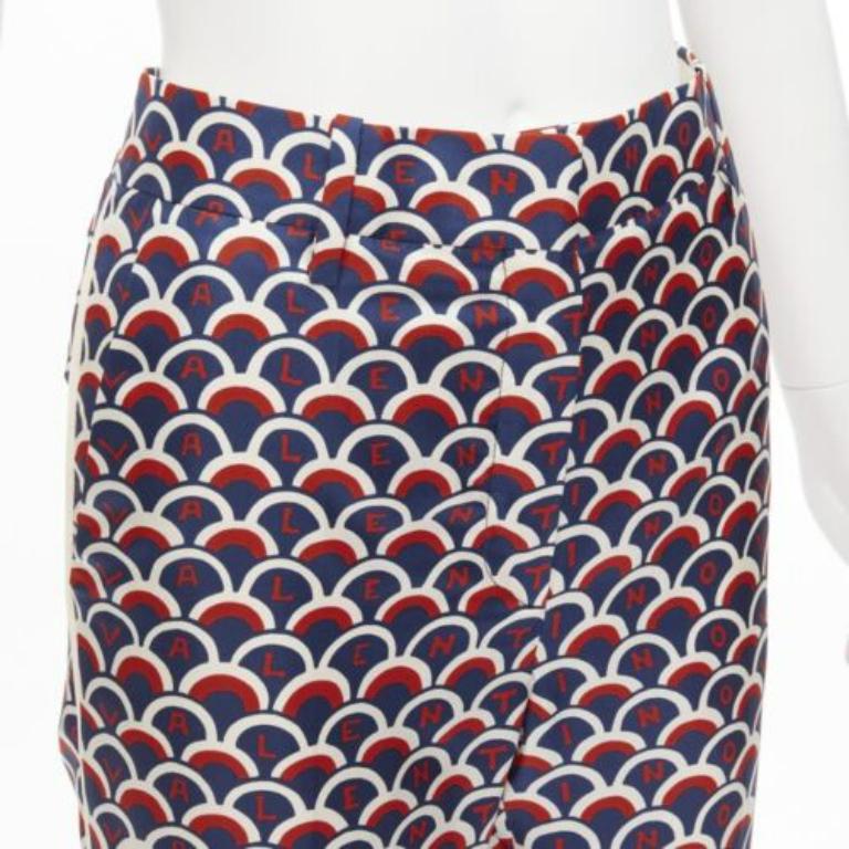 VALENTINO 100% silk  scallop print logo print navy red flared pants IT36 XXS
Reference: LNKO/A02245
Brand: Valentino
Designer: Pier Paolo Piccioli
Material: Silk
Color: Red, Navy
Pattern: Monogram
Closure: Zip Fly
Extra Details: Bas cut lining at