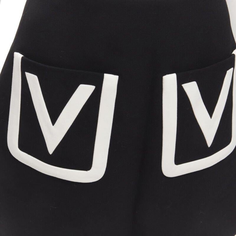 VALENTINO 100% virgin wool black V Logo patch pocket A-line skirt IT38 XS
Reference: AAWC/A00379
Brand: Valentino
Designer: Pier Paolo Piccioli
Collection: V Logo
Material: Virgin Wool
Color: Black, White
Pattern: Solid
Closure: Zip
Lining: 