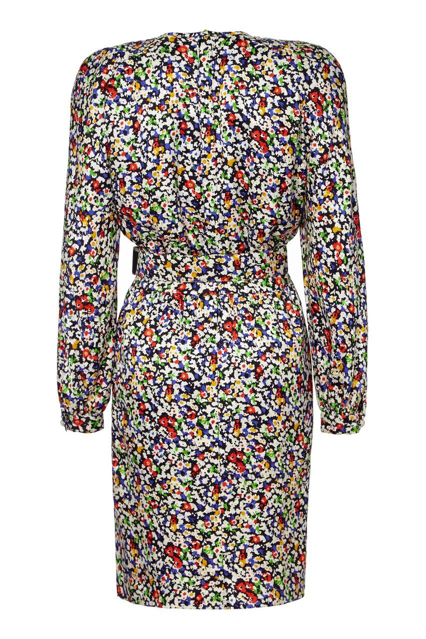 This vibrant 1980s silk dress with matching belt by Valentino is in superb vintage condition and is easily adaptable to suit a variety of occasions. The fine abstracted floral print is subtly textured and blends between monochrome and bursts of