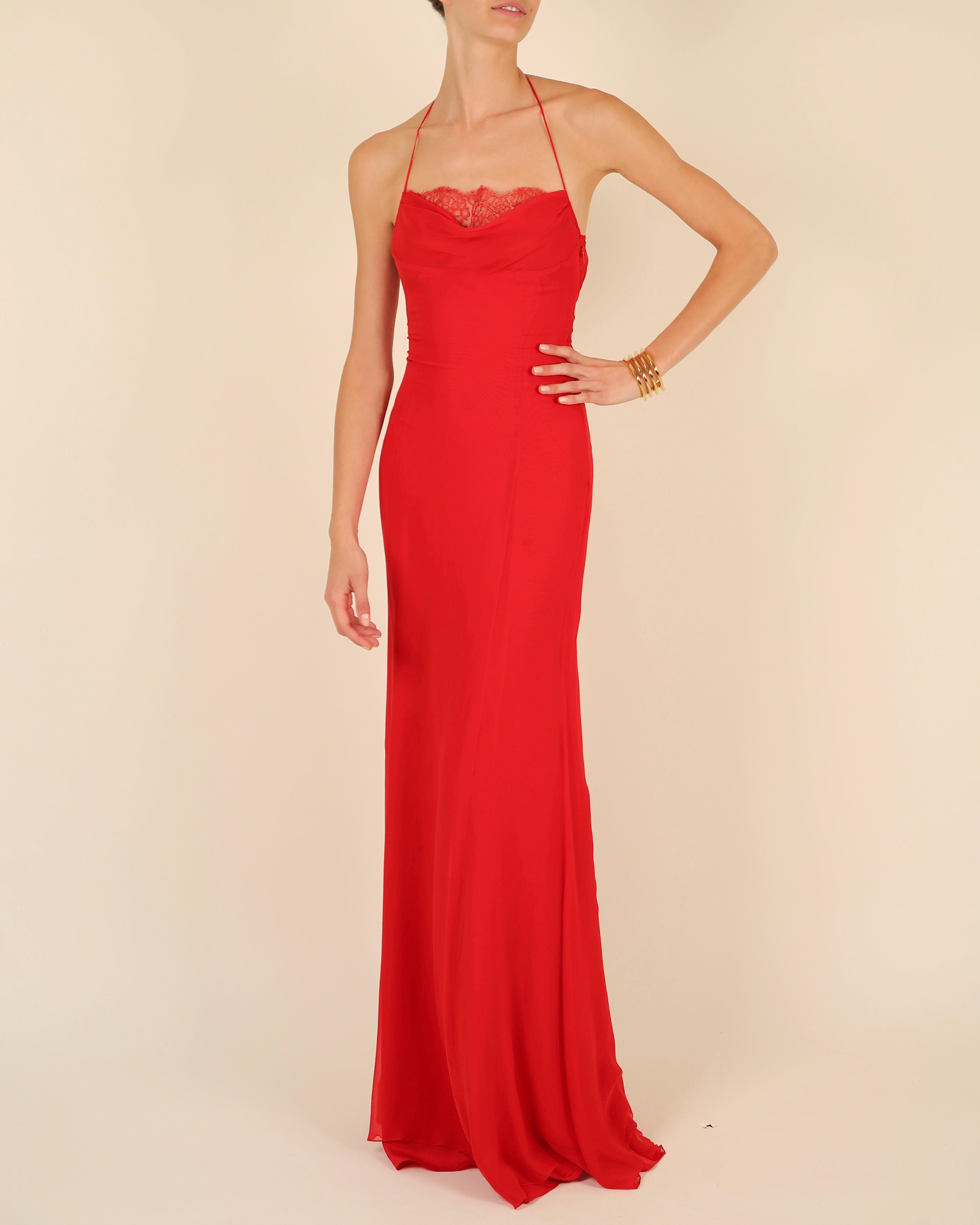 LOVE LALI Vintage

Valentino vintage silk gown circa 1990
This is an absolutely head turning gown in the most beautiful shade of Valentino red
Halter neck design that ties at the back of the neck with long spaghetti style straps
Lace peekaboo insert
