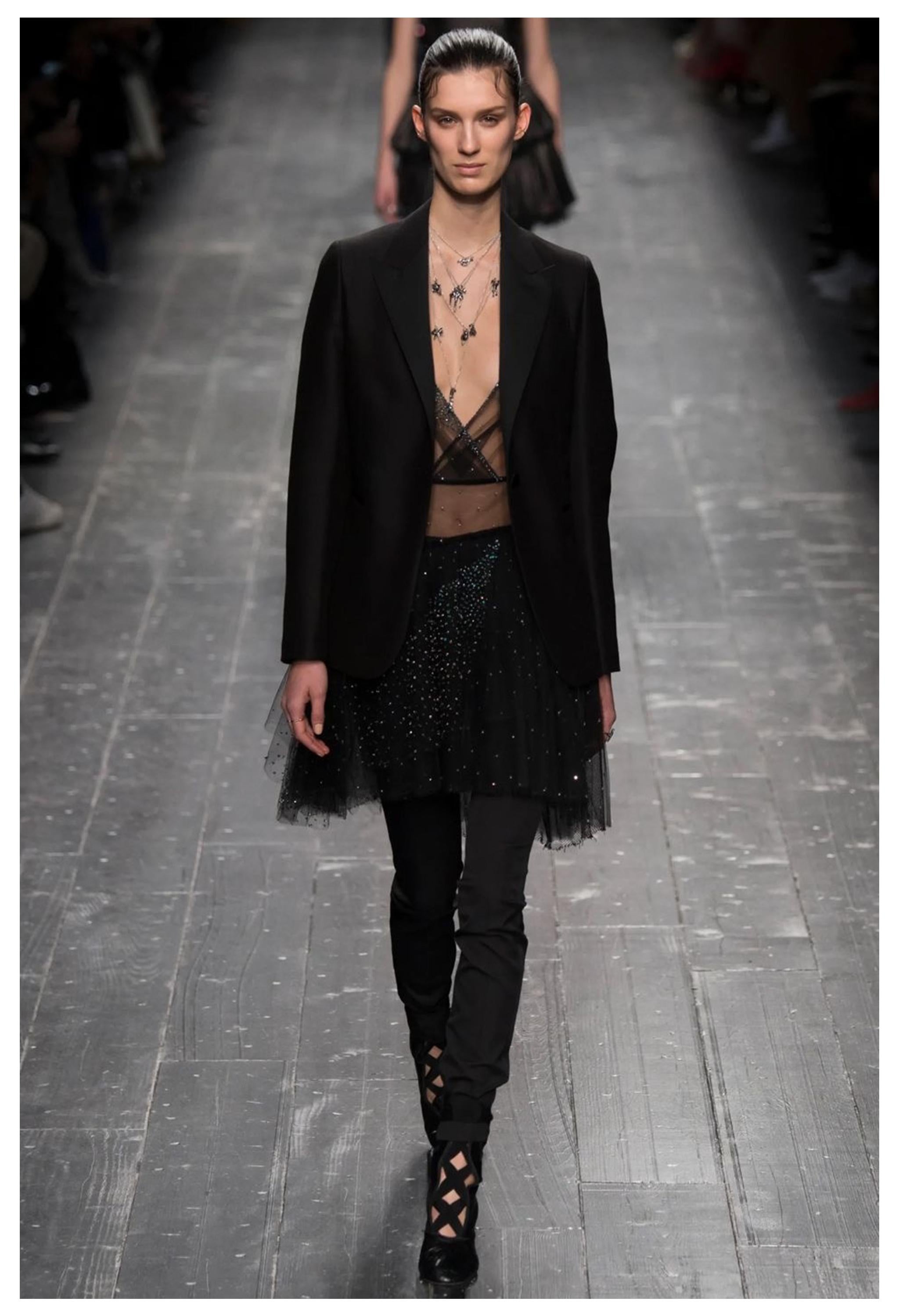 Resurrection Vintage is excited to offer a vintage Valentino black tulle cocktail dress featuring a ballet-inspired design, deep plunging neckline, beaded shoulder straps, multi-layer tulle skirt, beading at the bodice and skirt, sexy back, and
