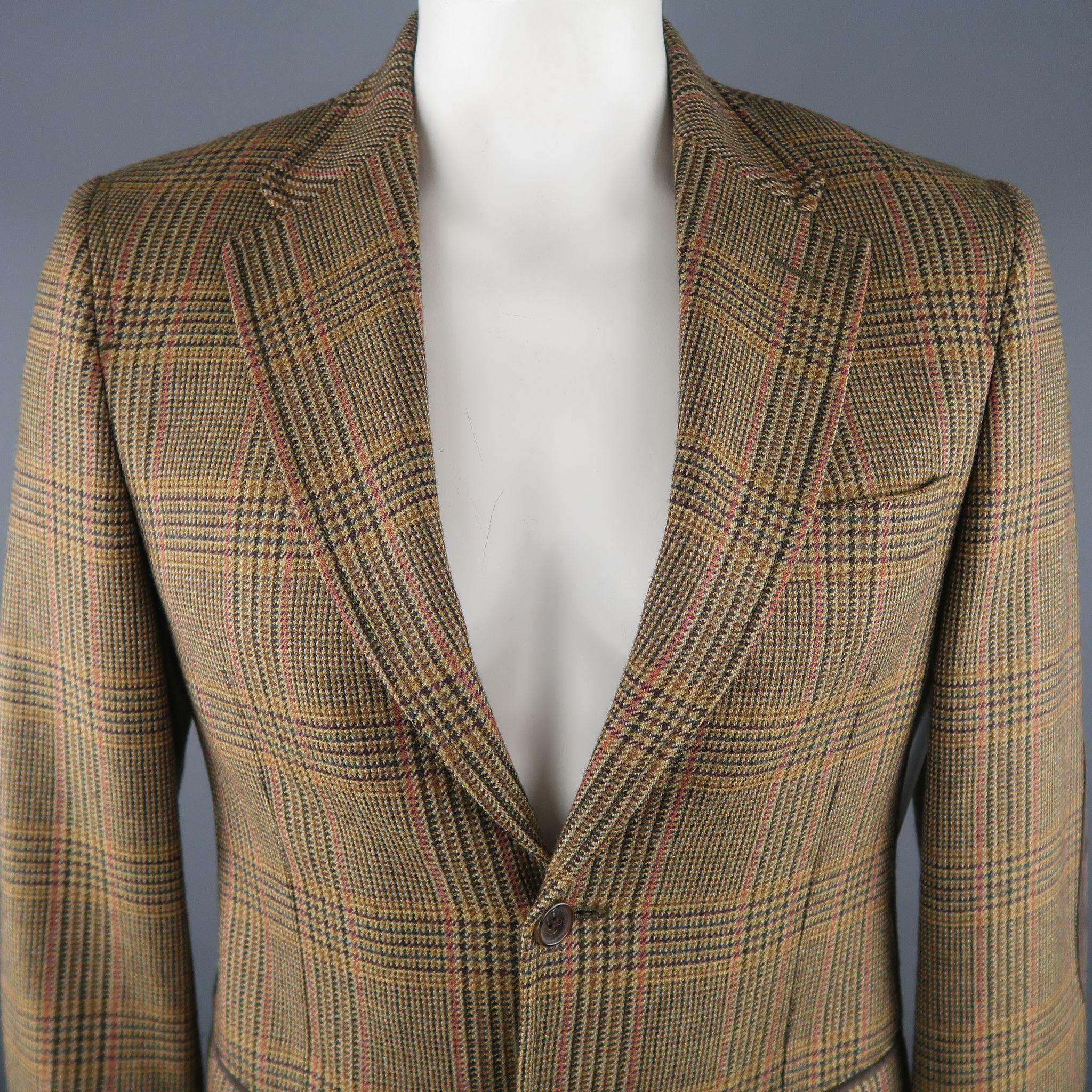 VALENTINO regular sport coat comes in a olive tone in a plaid wool material, with a notch lapel collar, suede trim, flap pockets, elbow patches, 2 button closure and unlined. Made in Italy.
 
Excellent Pre-Owned Condition.
Marked:  50 IT
