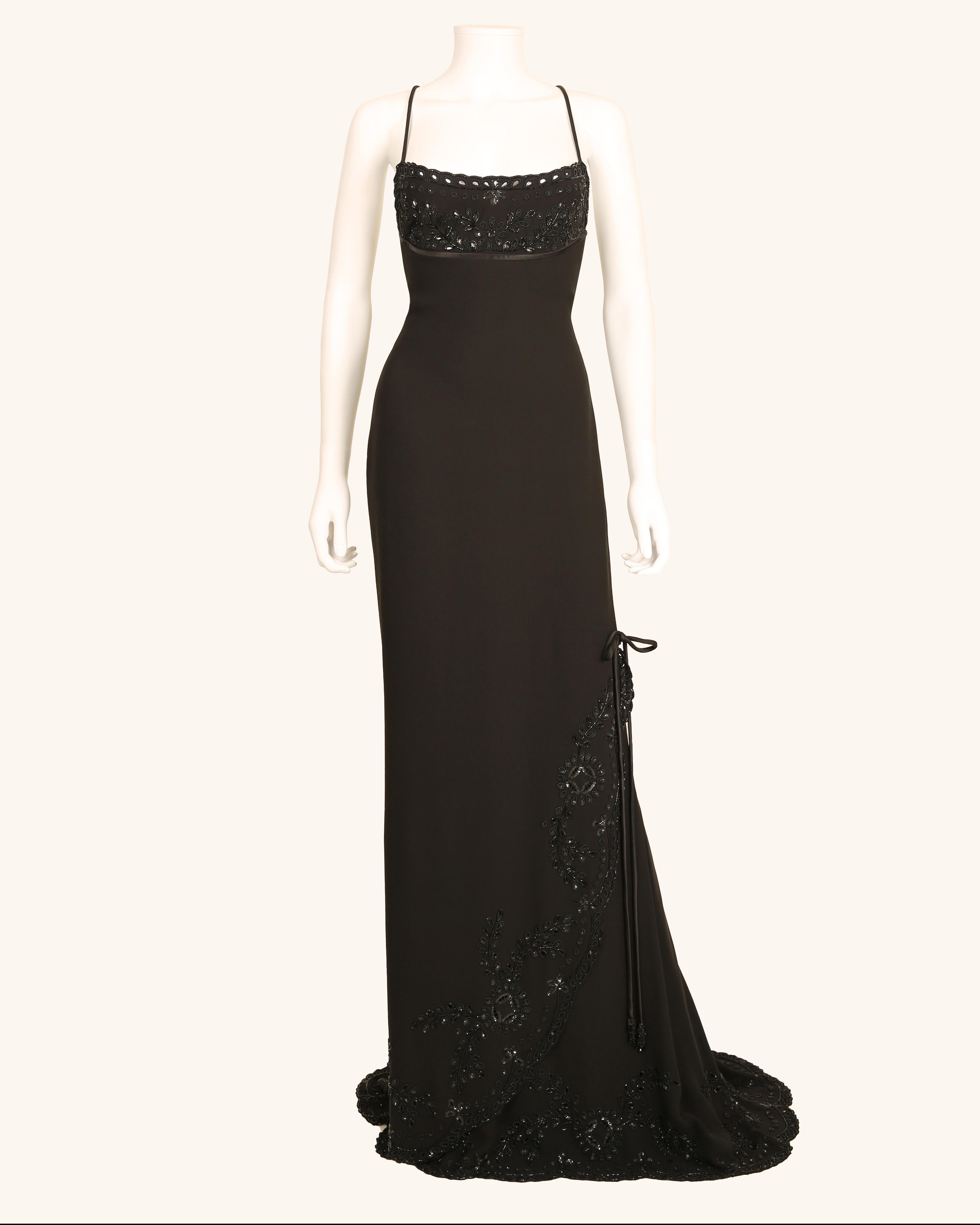 LOVE LALI Vintage

An incredibly rare black embellished gown from Valentino Spring/Summer 1998
Beautiful fine silk crepe that is cut on the bias, means that the dress drapes and moulds perfectly over the body, skimming over your curves for the most