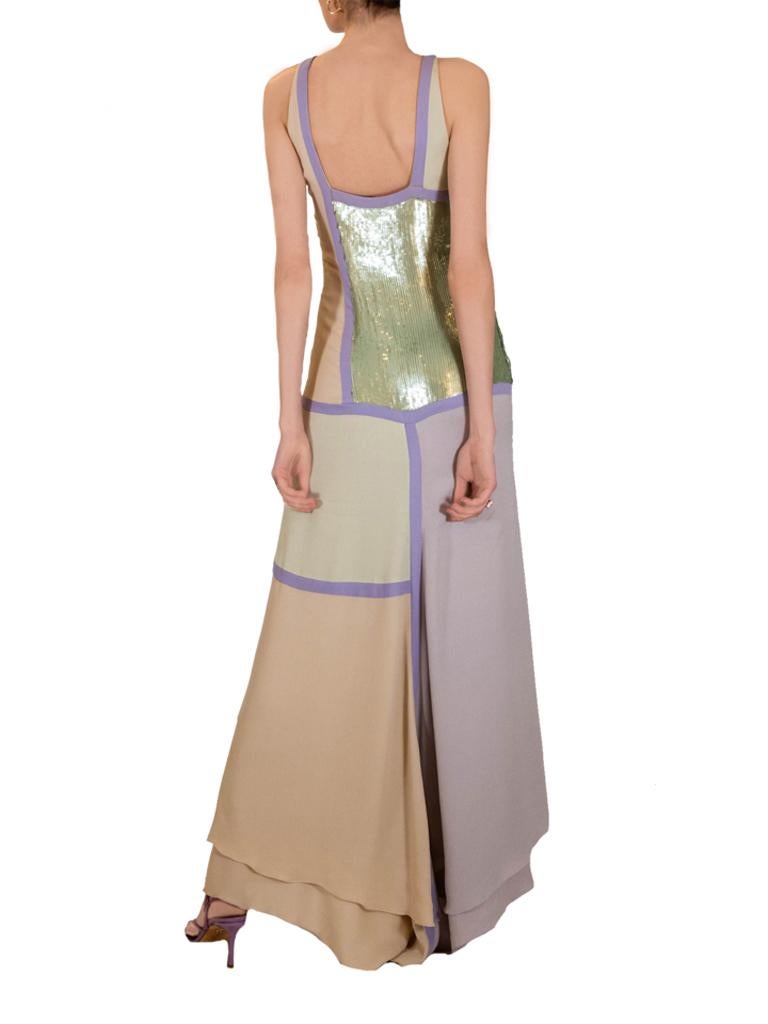 Striking Valentino evening gown, from the period when Valentino Garavani himself was still designing for the house. Featuring an almost Mondrian inspired abstract design made up of panels of crepe as well as sequin in muted pastel shades of