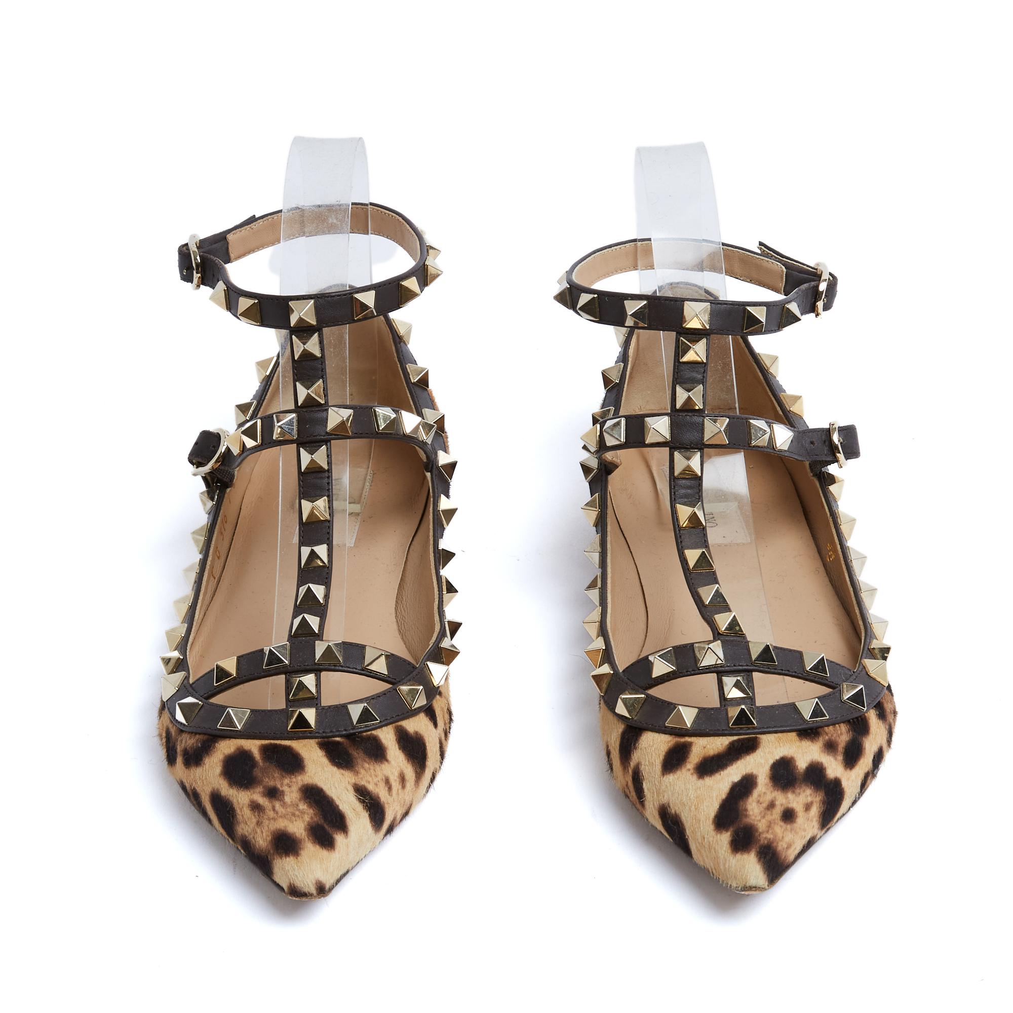 Valentino Rockstud classic ballerinas in leopard-print pony-skin calfskin with thin straps adorned with gold-tone metal studs, fastened with matching pin buckles, pointed toe, leather lining, insole and outsole. Size EU38, UK5 and US7.5. The