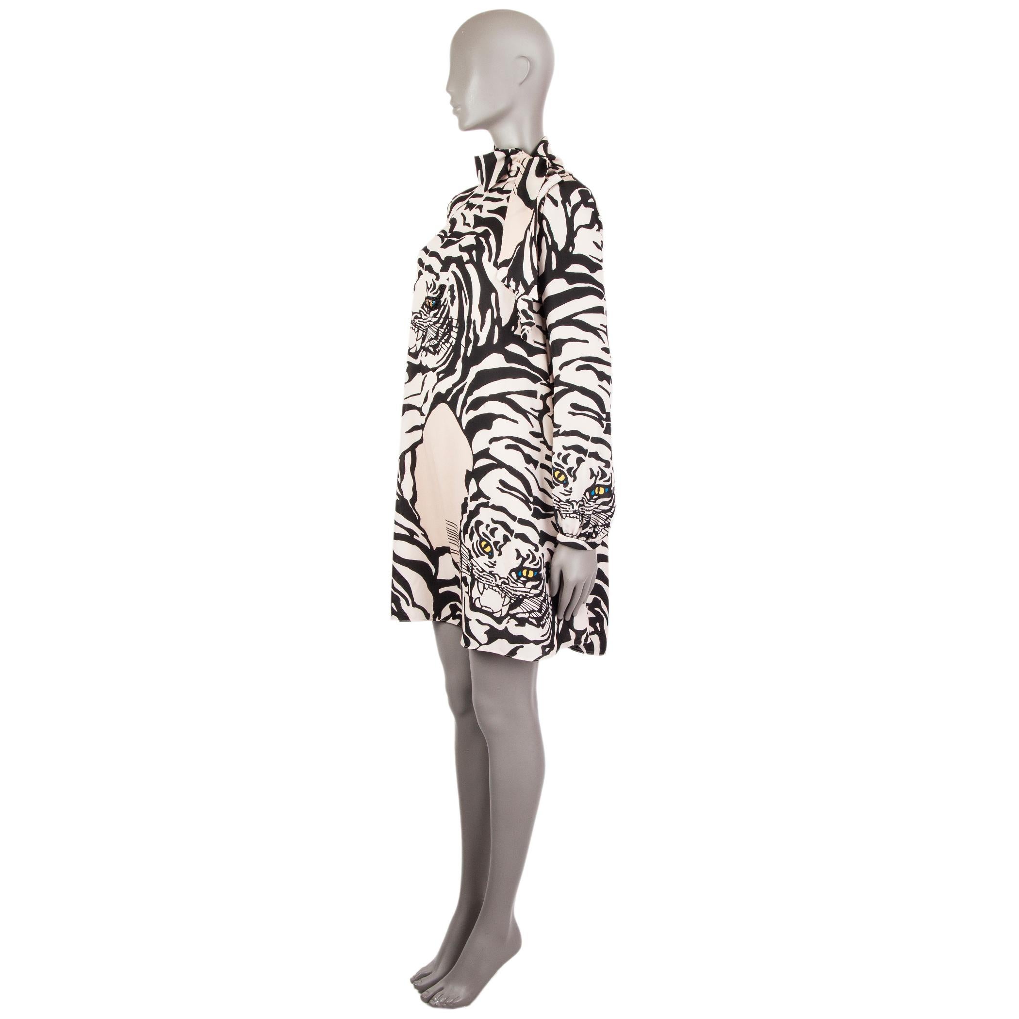 Valentino long-sleeve tiger-print dress in sand and black silk (100%) with a mock-neck and self-tie bow. This was a revival print from 1967. Closes on the back with concealed zipper and buttons on the cuffs. Lined in (91%) silk and elastane (9%).