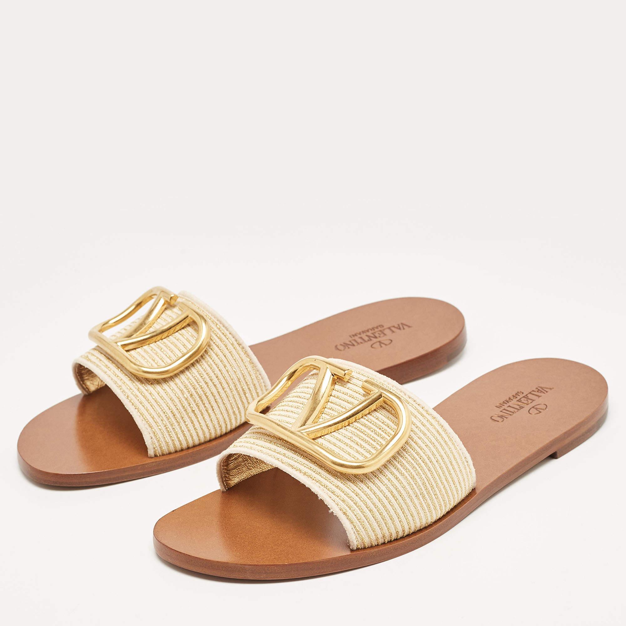 Complete your look by adding these Valentino VLogo flat slides to your lovely wardrobe. They are crafted skilfully to grant the perfect fit and style.

Includes: Original Dustbag, Original Box, Info Booklet