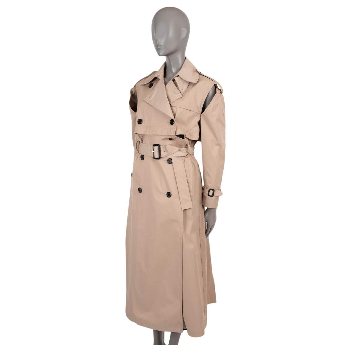 100% authentic Valentino convertible trench coat in beige polyester (62%) and cotton (38%). Bottom unbuttons and converts to cropped jacket. Features partially detached sleeves, epaulettes, matching belt and belts at cuffs. Closes with buttons and