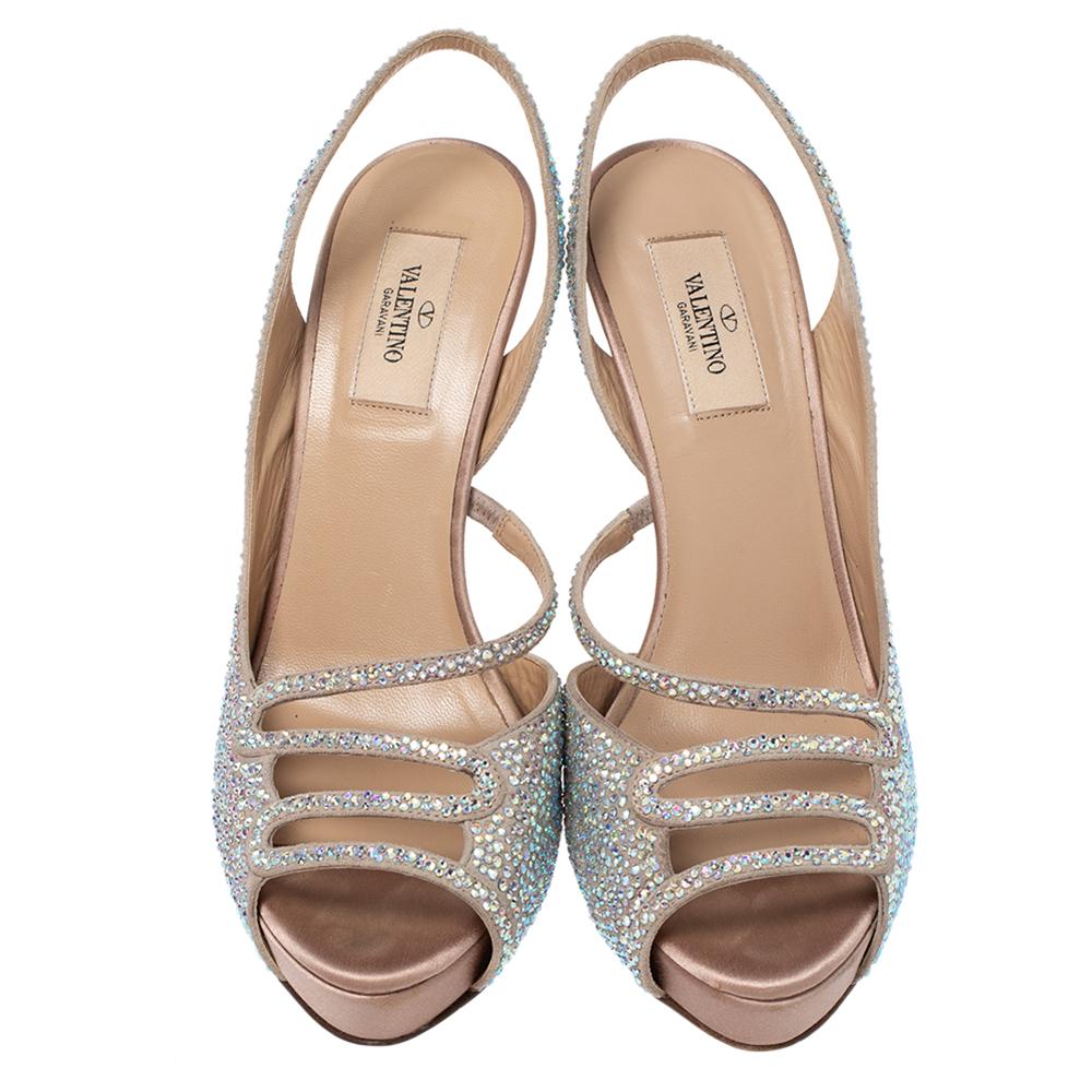 These Cinderella inspired fairy tale shoes are made from beige suede and accented with beautiful sparkling crystals. They come with vamp straps, peep toes, and 12.5 cm heels. They feature slingback straps and leather-lined insoles.

Includes: