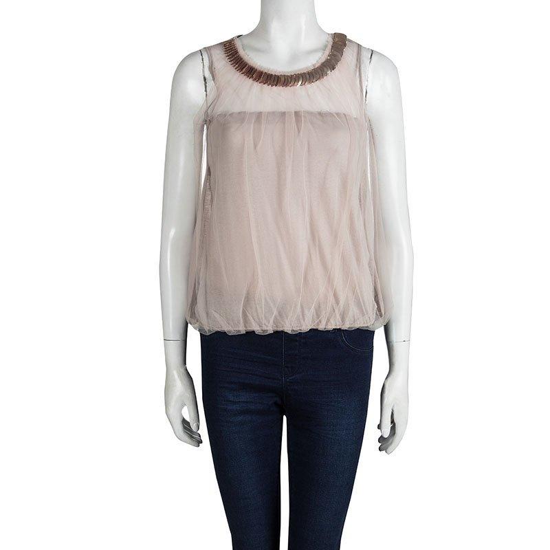 Valentino Roma is a sub-label of Italian fashion house Valentino that is launched to provide designs for more casual, every day looks. This beige cotton top is rendered in a sleeveless construction with mesh overlay that showcases brand's