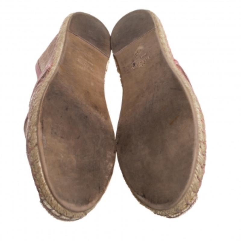 Chic and classic, these Valentino flats are the exemplar of the label's feminine sensibilities. Crafted from sheer lace that delicately accentuates the foot is trimmed with leather. Featuring a braided midsole, they are ideal for summertime edits.