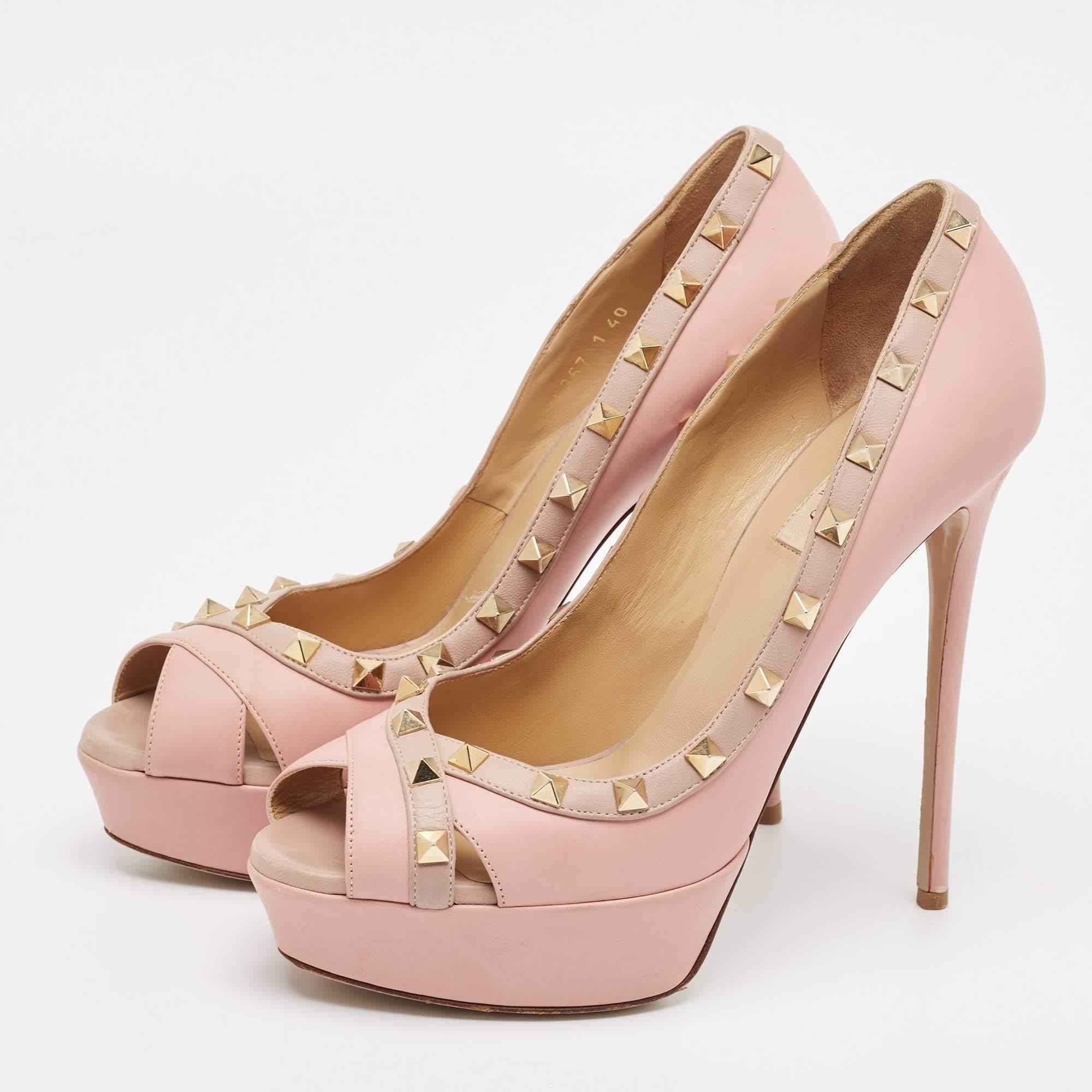 Make a statement with these Valentino pink pumps for women. Impeccably crafted these chic heels offer both fashion and comfort elevating your look with each graceful step.