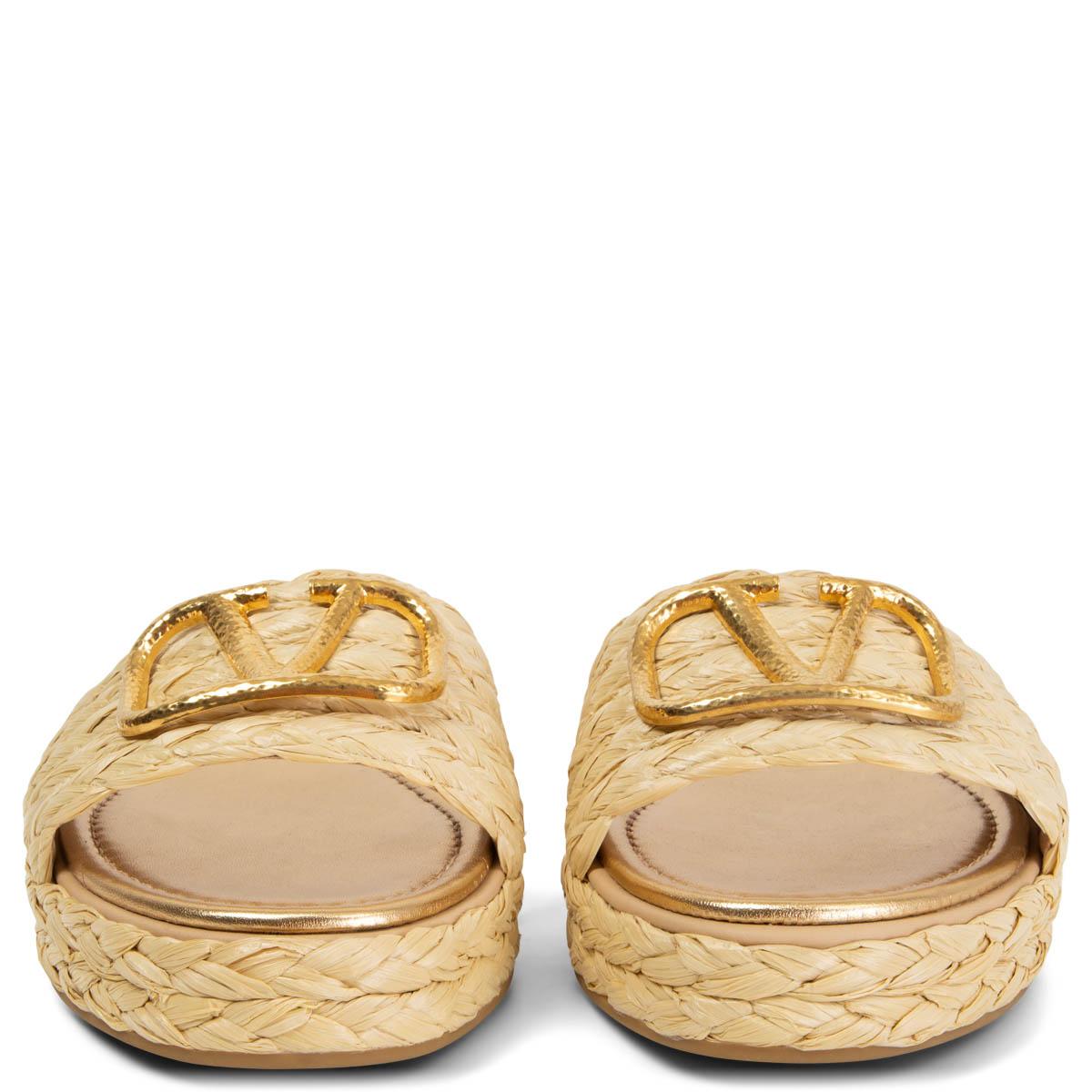 100% authentic Valentino VLOGO espadrille slide sandals in light beige natural raffia with the Valentino logo in hammered matte gold-tone. Have been worn once or twice and are in excellent condition. 

Measurements
Imprinted Size	38
Shoe