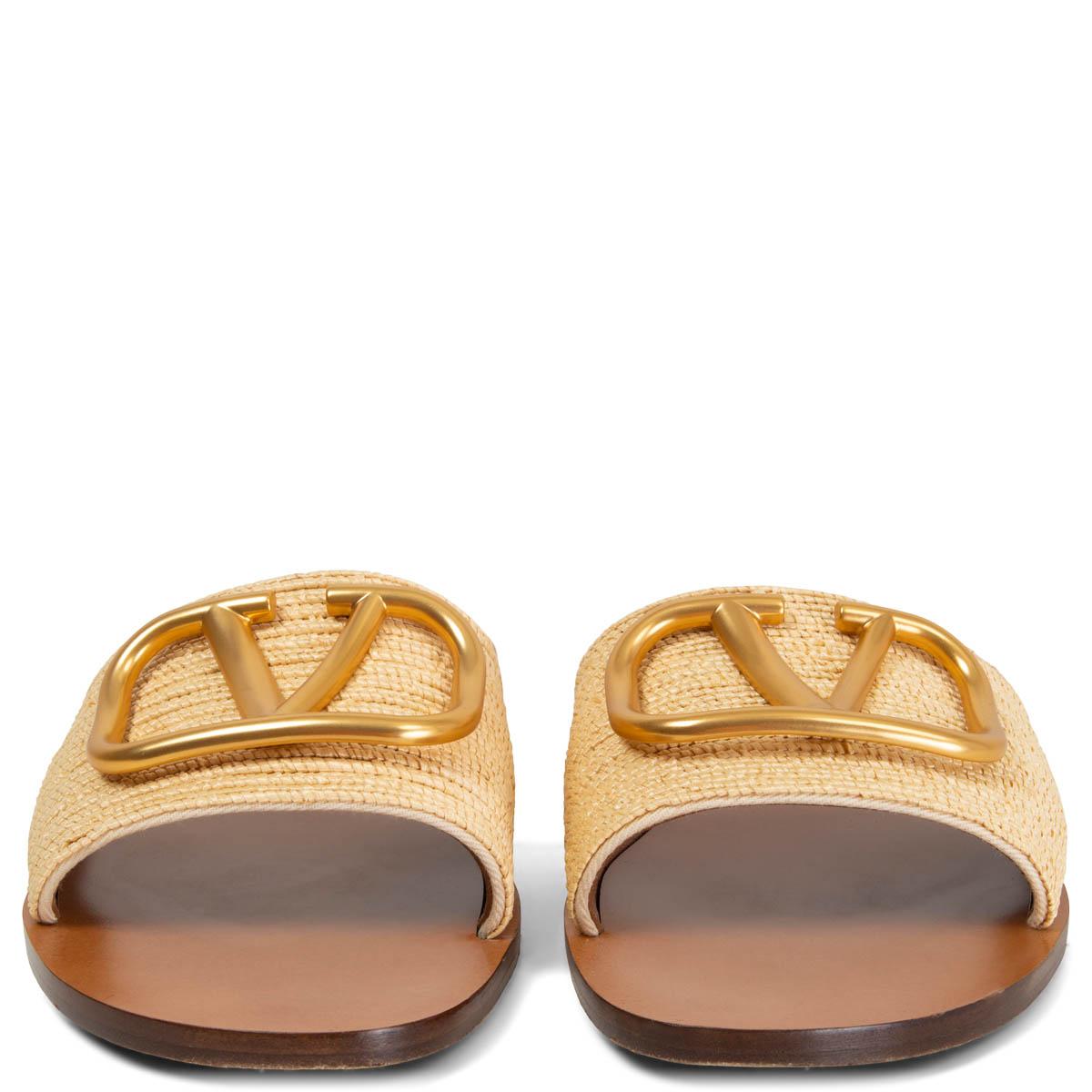 100% authentic Valentino VLOGO slides in beige raffia are topped with the label's 'VLOGO' plaque in gold-tone, which is burnished for an antique effect. Have been worn and are in excellent condition. 

Measurements
Imprinted Size	37.5
Shoe