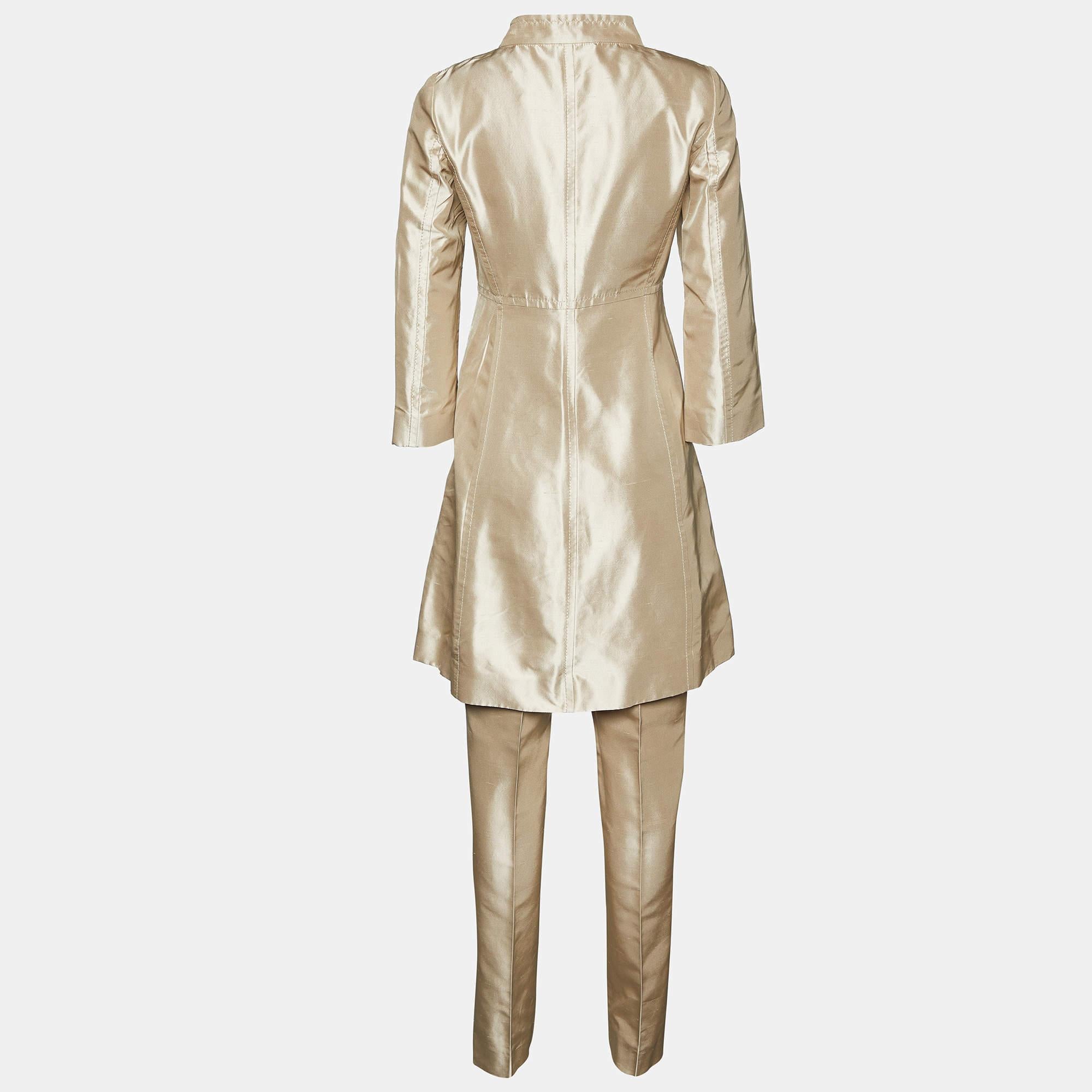 Cruise in style on your way to fashionable outings with this designer coat and pants suit. The luxe Valentino creation is made of fine fabric.

