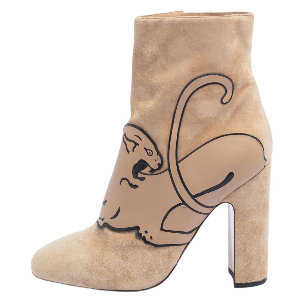 Designed by Valentino, these ankle boots are for fashionable souls. Made using suede, they feature panther motifs, side zippers, and 12 cm block heels. The Valentino boots are just right to nail a fashion-forward look.

Includes: Original Dustbag,