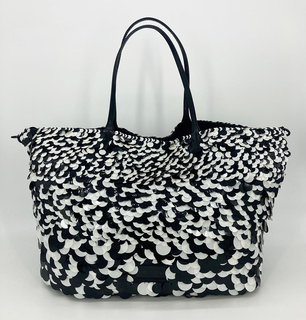 Valentino Black and White Paillette Sequin Tote in good condition. Unique round black and white sequins in various sizes over a black satin body with black patent leather trim and black hardware. Top double handles and removable shoulder strap