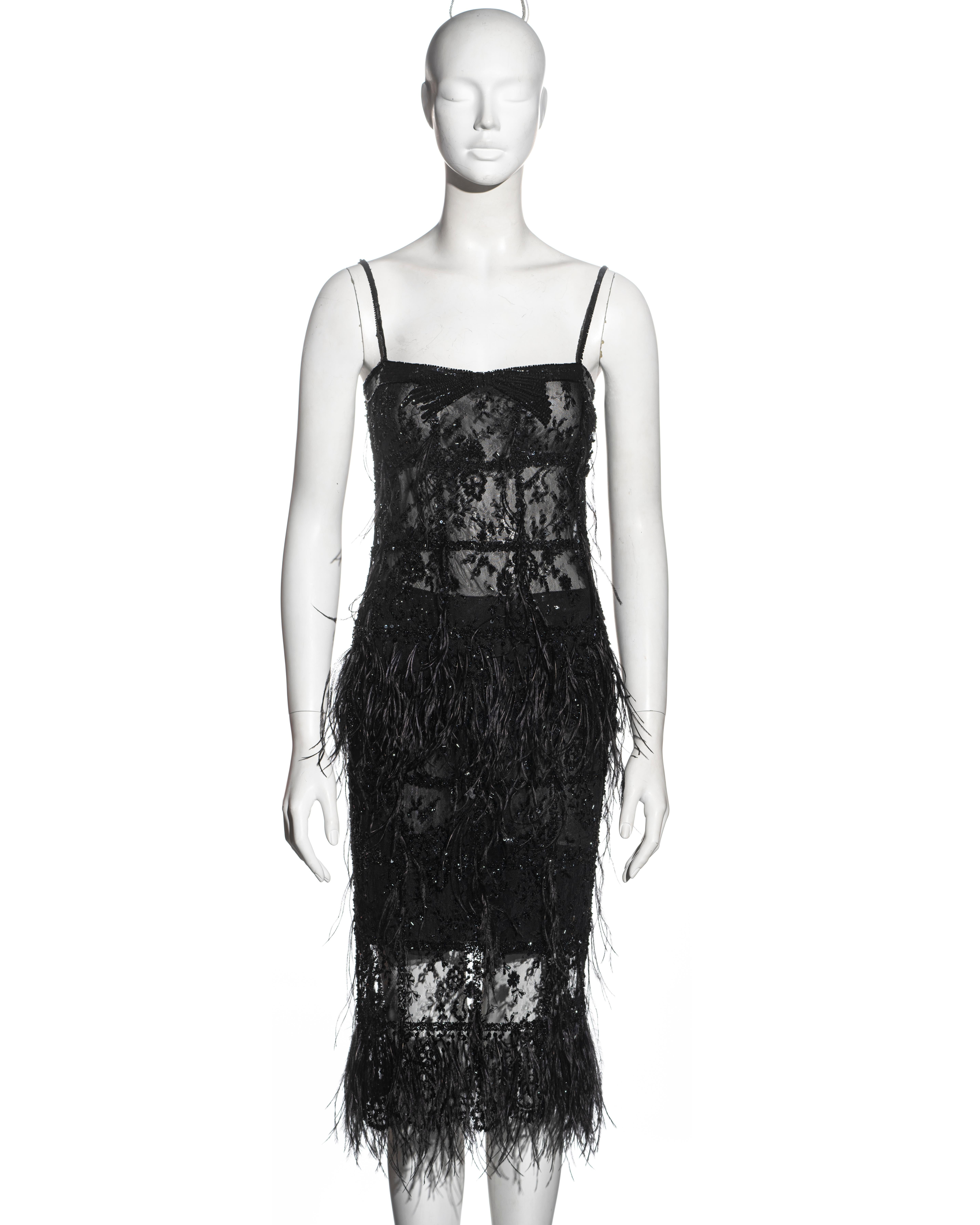 ▪ Valentino evening top and skirt set 
▪ Black beaded French lace 
▪ Ostrich feather trim 
▪ Spaghetti strap top 
▪ Matching mid-length skirt 
▪ US 6 - FR 38 - UK 10 - IT 42 
▪ Fall-Winter 2001
▪ Made in Italy