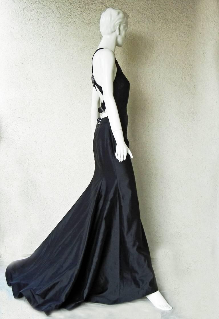 Valentino high fashion stunner from one of the designer's most exciting and sold out collections of 2001. Sleeveless racer back gown fashioned of black shantung silk. Criss-cross double strap back adorned with clear Swarovski crystal adjustable