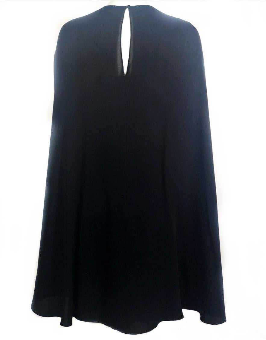 VALENTINO Navy Cape Dress Size 42

Product details:
Size 42
Back one button closure on the top
Back zipper closure from the waist down under the cape 
Made in Italy

