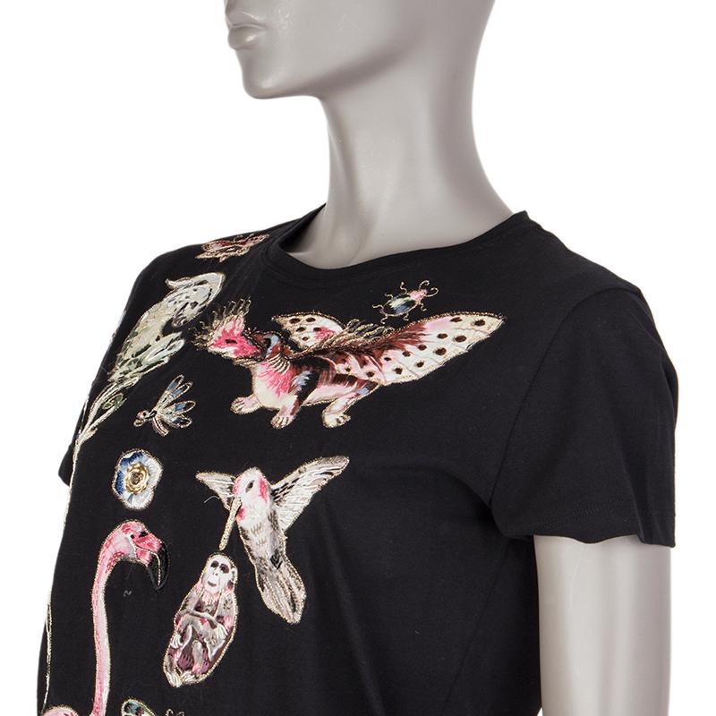 Valentino t-shirt in black cotton (probably as content tag is missing) with animal embroidery in pink, white, green, blue and brown. Has been worn and is in excellent condition.

Tag Size Missing Tag
Size S
Shoulder Width 40cm (15.6in)
Bust 96cm