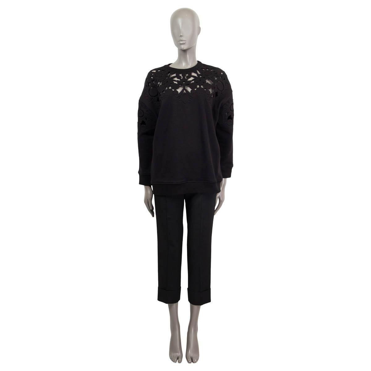 100% authentic Valentino oversized laser-cut detailed sweater in black cotton (97%) and elastane (3%). Has been worn and is in excellent condition. 

Measurements
Tag Size	XS
Size	XS
Shoulder Width	57cm (22.2in)
Bust From	118cm (46in)
Waist