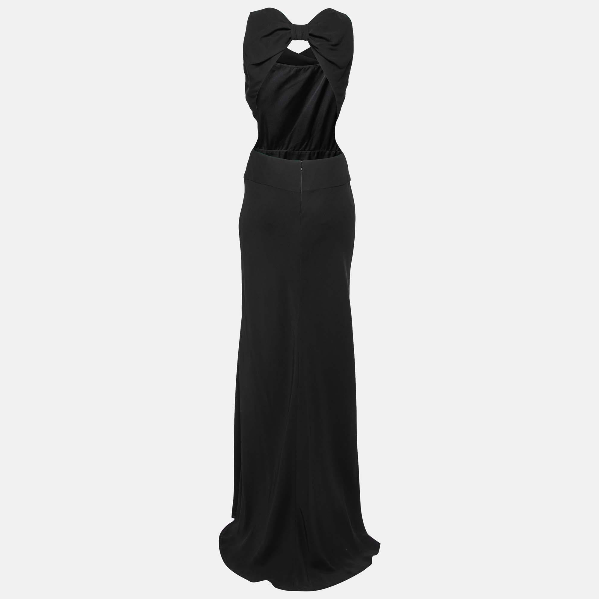 Valentino does perfect black dresses and this one is no exception. Skillfully crafted from crepe, the sleeveless dress is a deep rich black in color. It displays a cut-out back and a bow detail. It is perfect for formal dinner parties.

Includes: