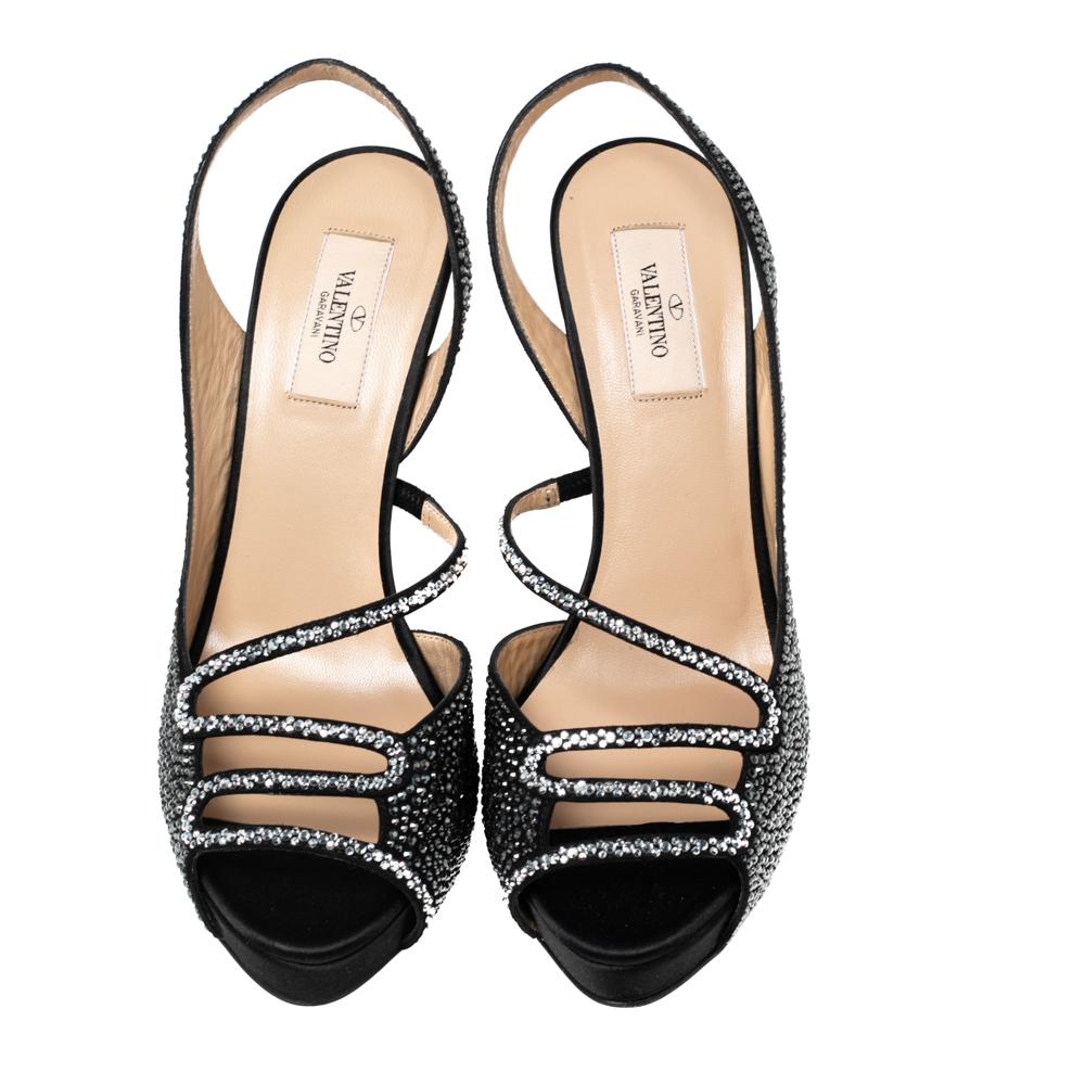 Pair your favorite outfit with these Valentino sandals for glam and stylish look. This impressive pair of satin sandals make a wonderful style statement. They feature crystal embellishments, slingbacks, and 13 cm heels.

Includes: Original Dustbag,