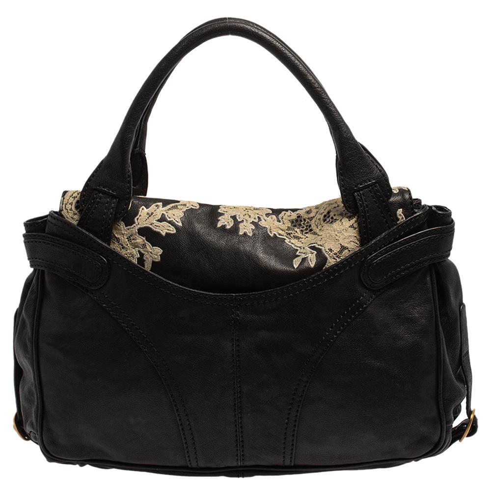 Every modern-day wardrobe needs a Valentino tote like this. Get this contemporary leather bag featuring a modern touch of florals & lace. The fabric used in this bag is of refined quality that lends durability. Elegance pairs with style for this