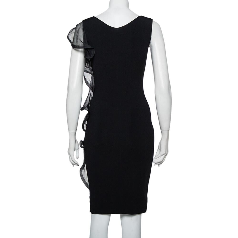 Designs by Valentino are always a delight to own, and so is this sheath dress. It features a lovely black hue all over along with a sleeveless silhouette and ruffle trims on the side. This pretty outfit is an excellent wardrobe choice.

